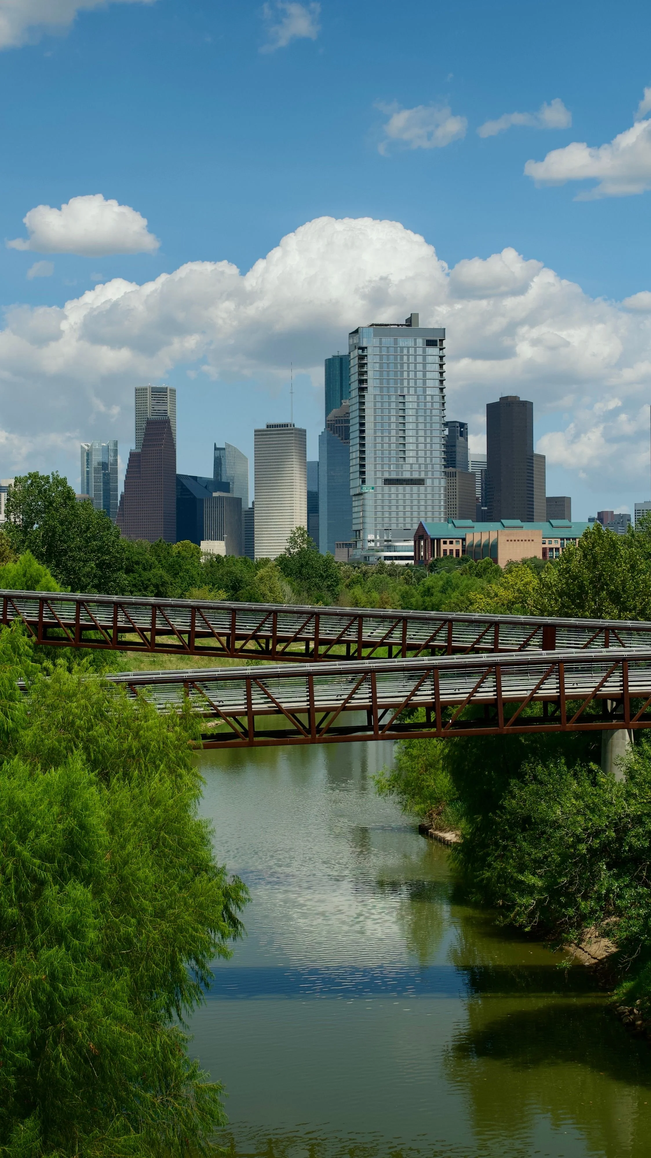 Downtown Houston, TX skyline and bayou bridge, the area Ra'Shunda and Jason Adams serve with coaching and therapy