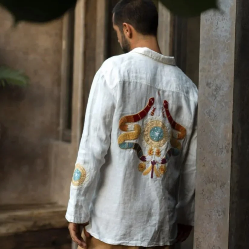 Linen men&rsquo;s shirt with Huichol embroidered serpents available in store now ✨