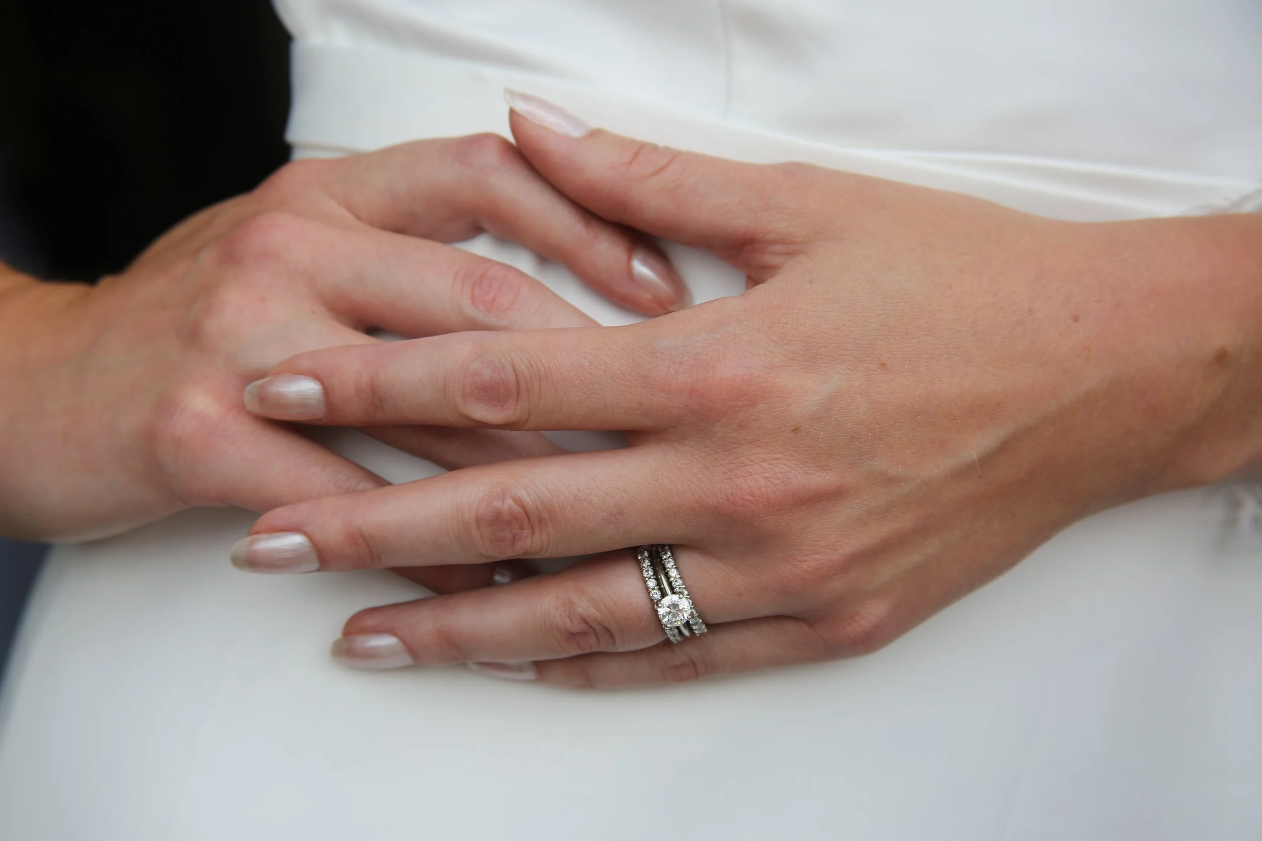 Bridal ring and hands.