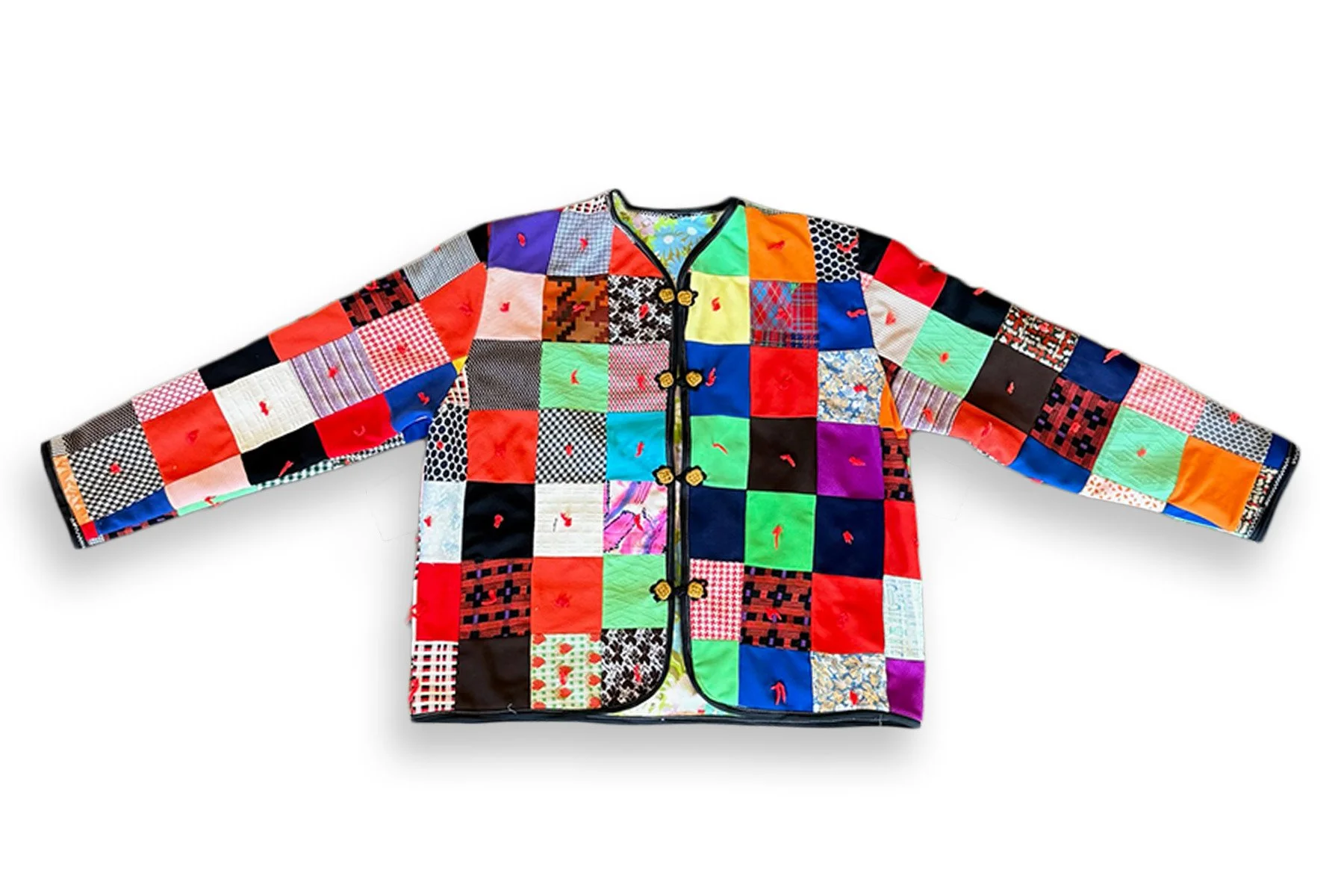 STATEMENT JACKET
 
 
One-of-one jacket made from a second-hand patchwork quilt, preserving its original mix of color, pattern and hand-tied red yarn knots throughout. Finished with black binding, decorative closures, and a contrasting vintage 1970s f