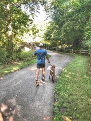 Running on one of the beautiful Lenexa trails with my grand-dog Wrigley.