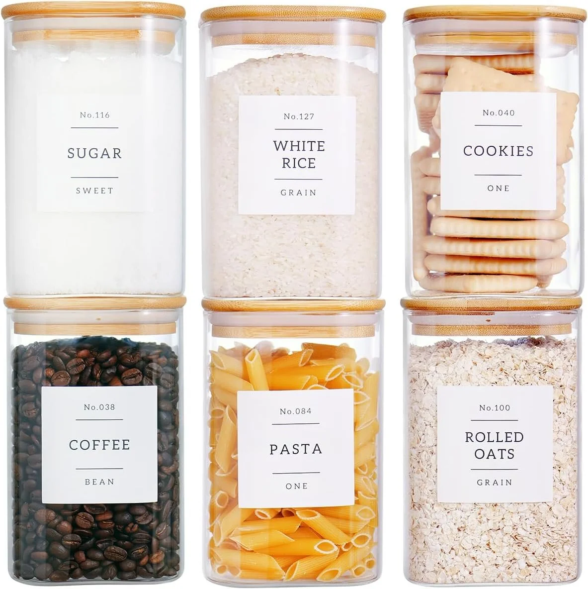 glass containers with labels for kitchen storage with snacks and sugar inside