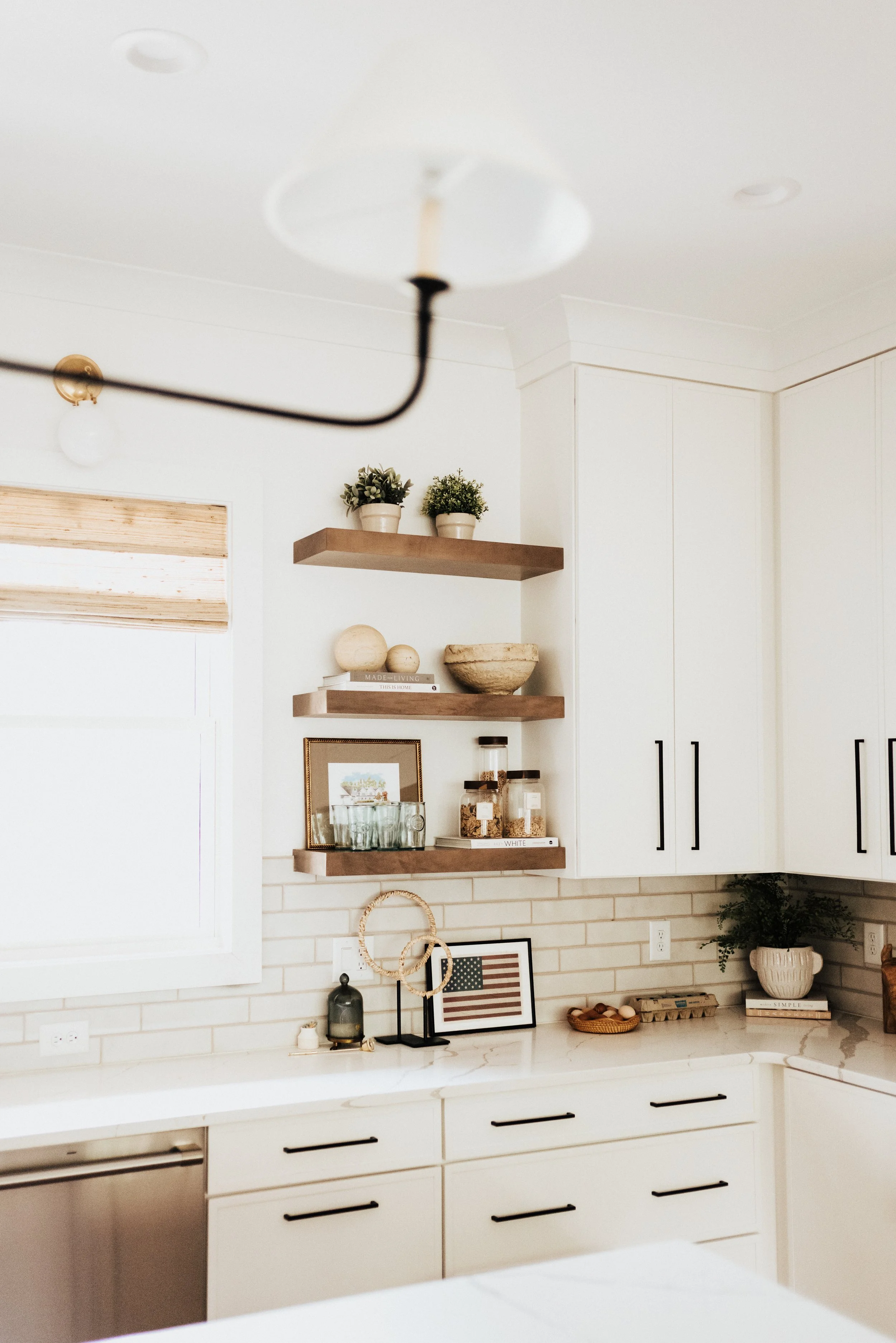 kitchen open wood shelving with decor pieces and american flag decor
