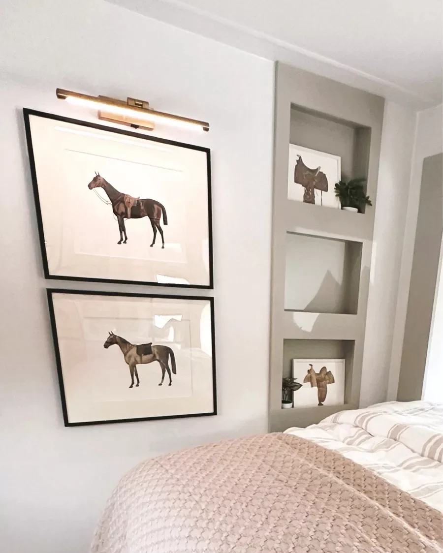 horse photos with gold rechargeable light next to a bed in an RV