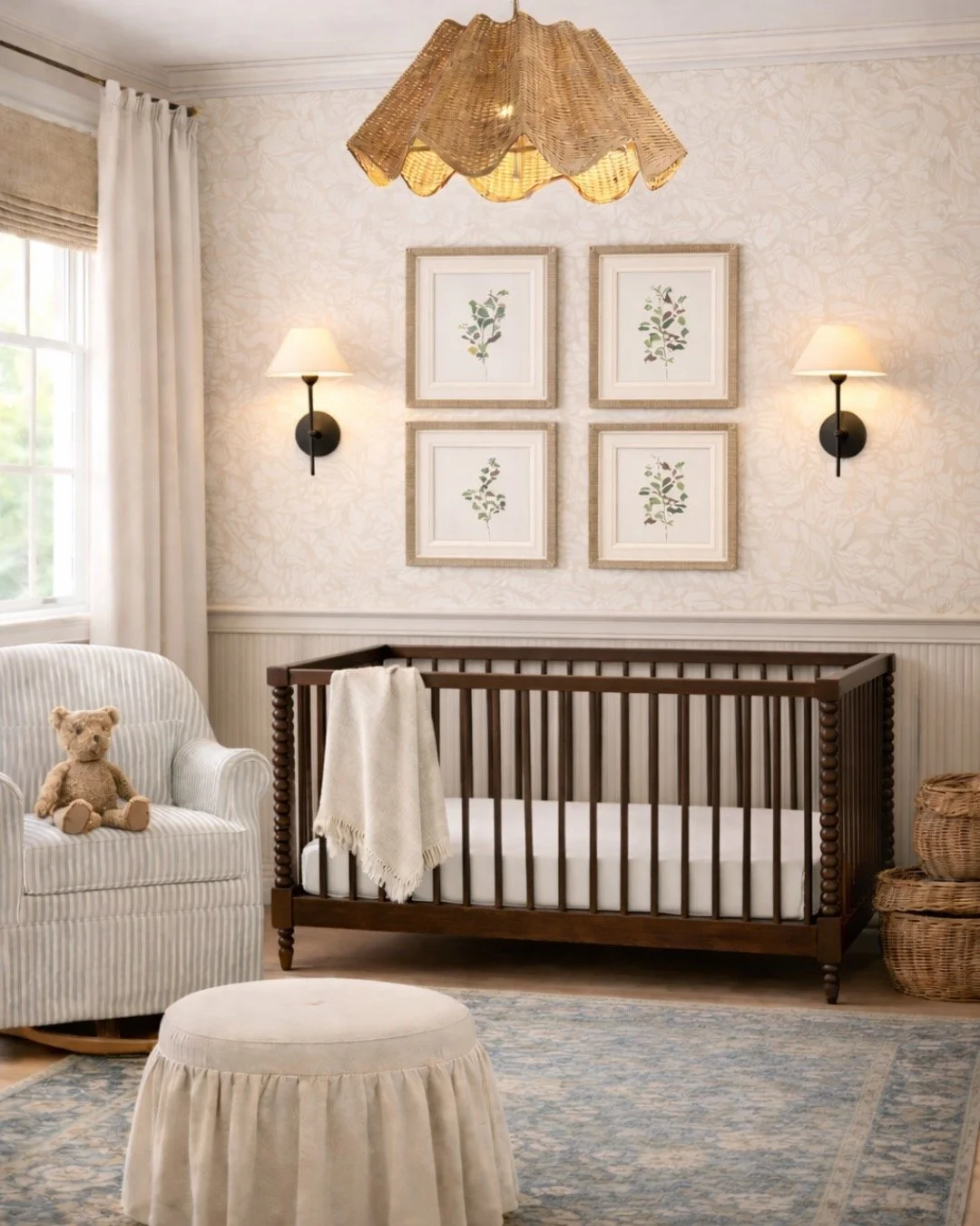 girls nursery with brown crib and floral pictures with sconces