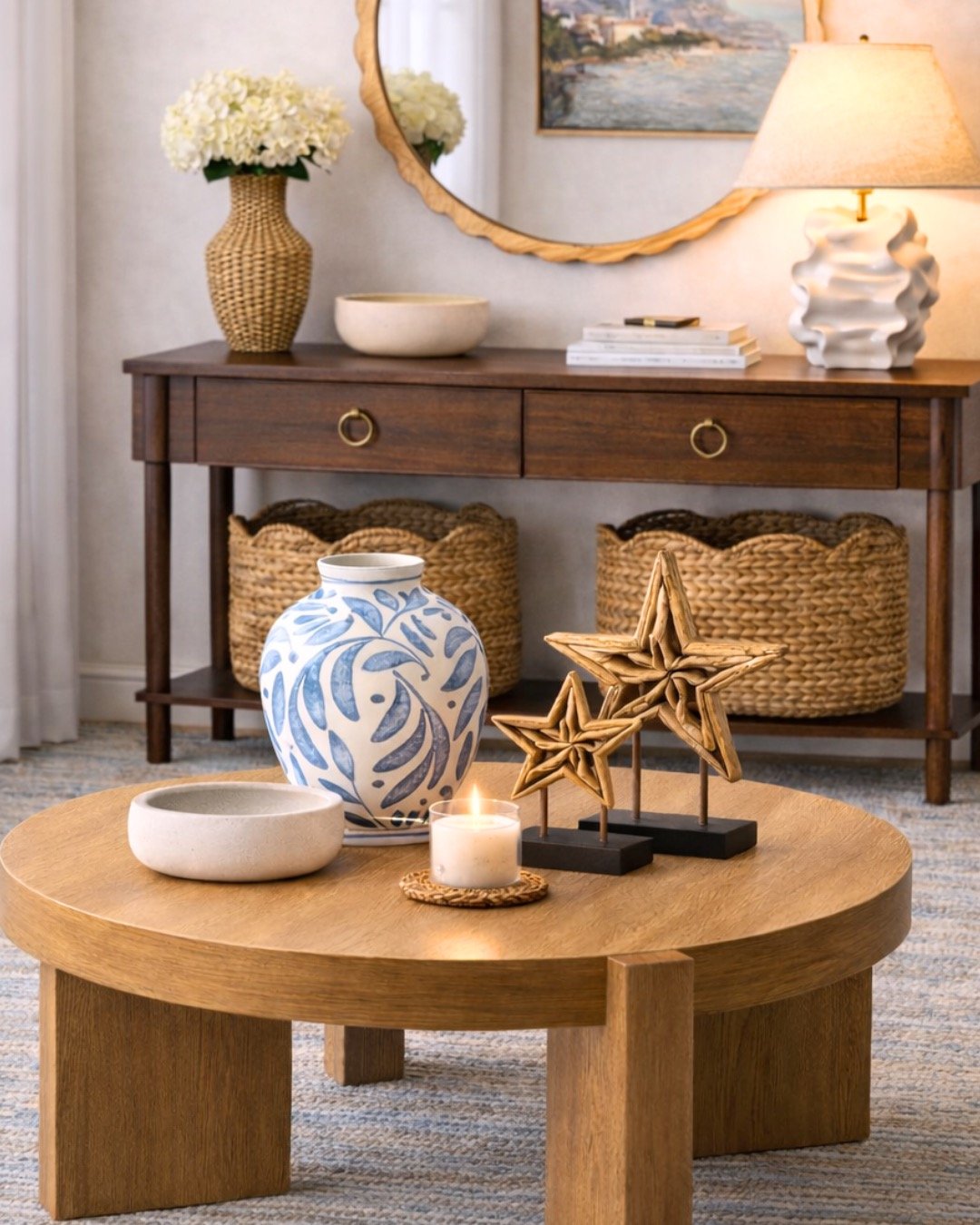 indoor wooden coffee table with a vase centerpiece, with a candle and wooden stars