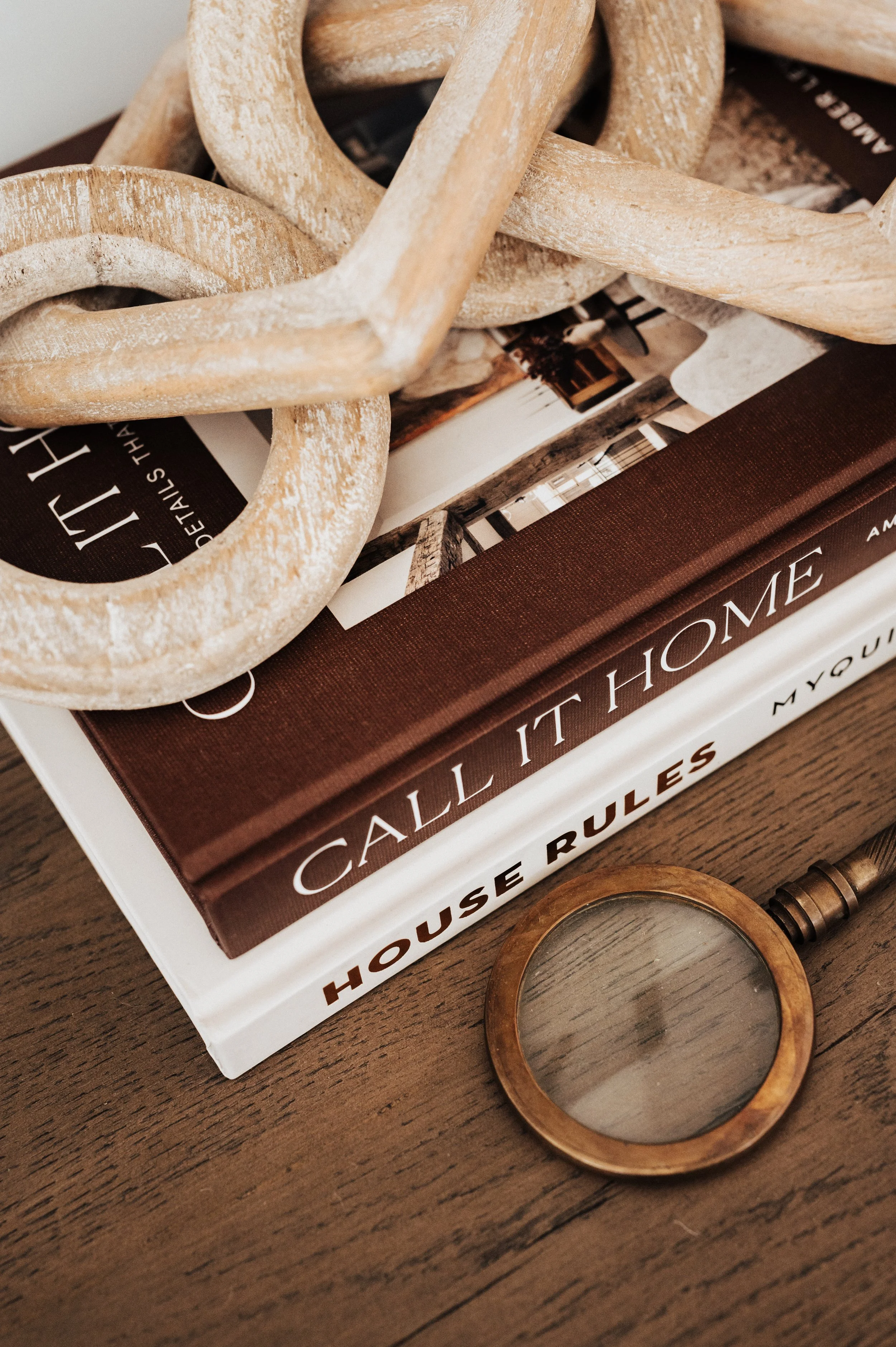 console table books with magnifying glass and wooden links
