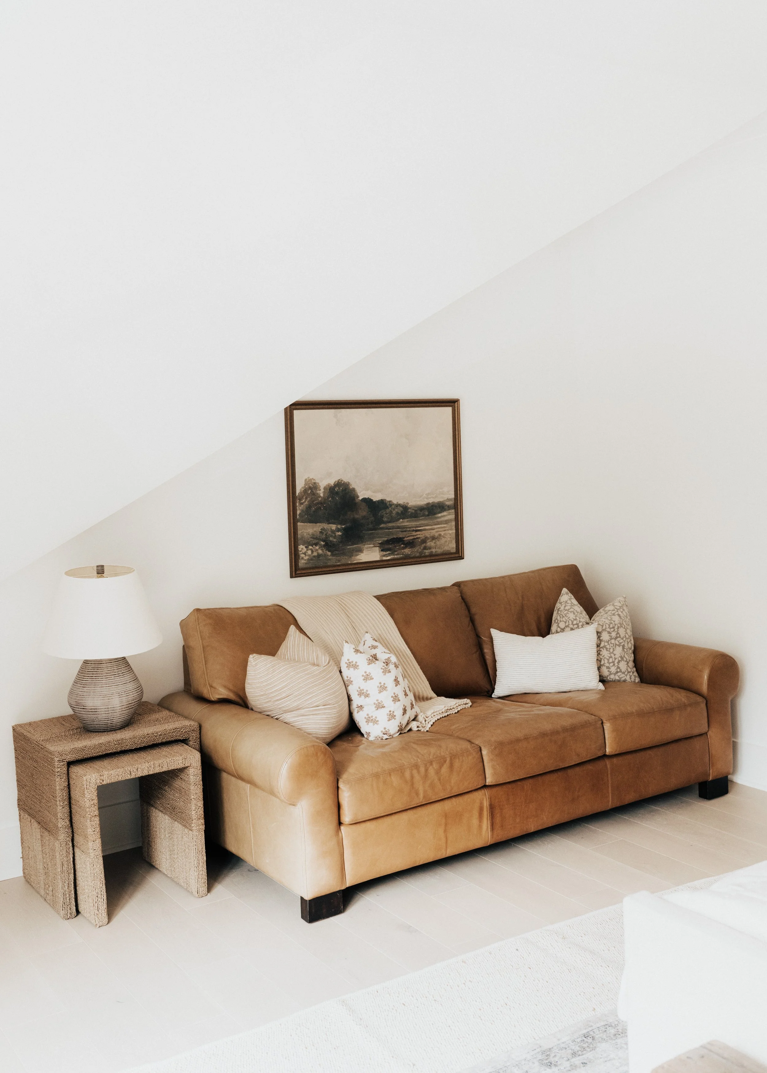 guest bedroom leather chair with pillows