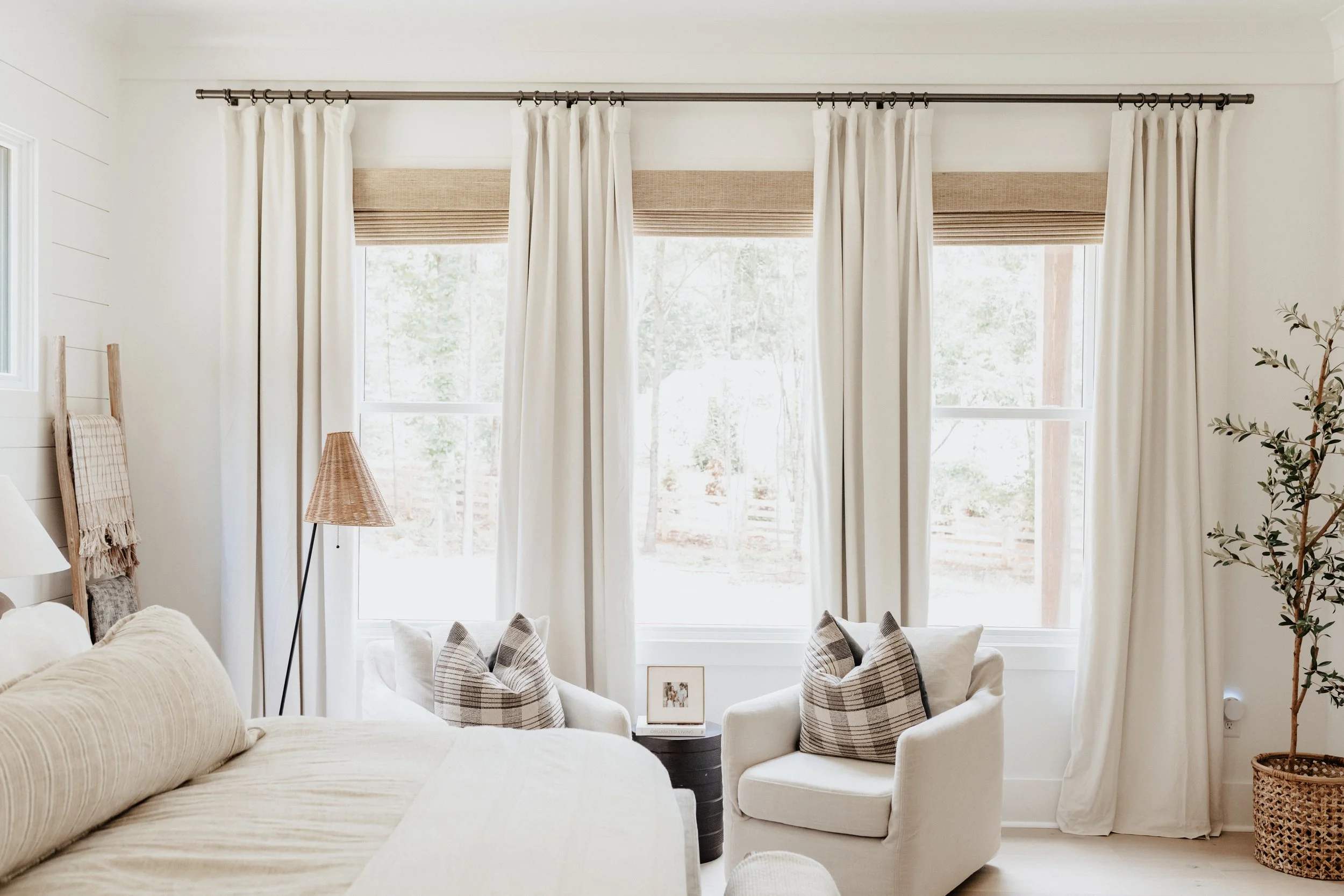 primary bedroom with loads of natural light and neutral touches