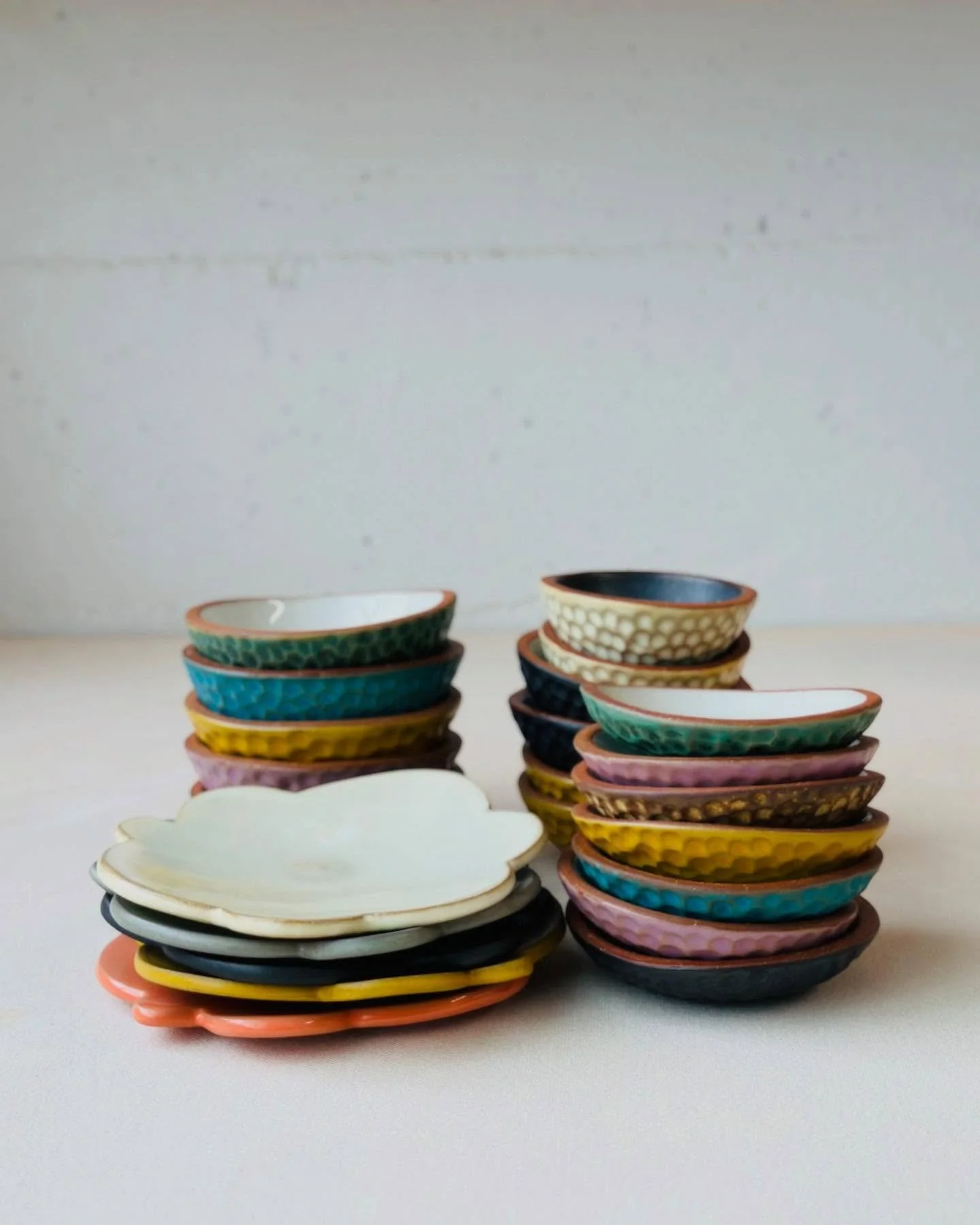 I normally fire to cone 5, but I fired a few small pots to cone 6 this time.  The glazes came out more glassy and fluid as expected, the buff clay fired darker and there was some warping so a lot of these will be &lsquo;seconds&rsquo;. But there was 