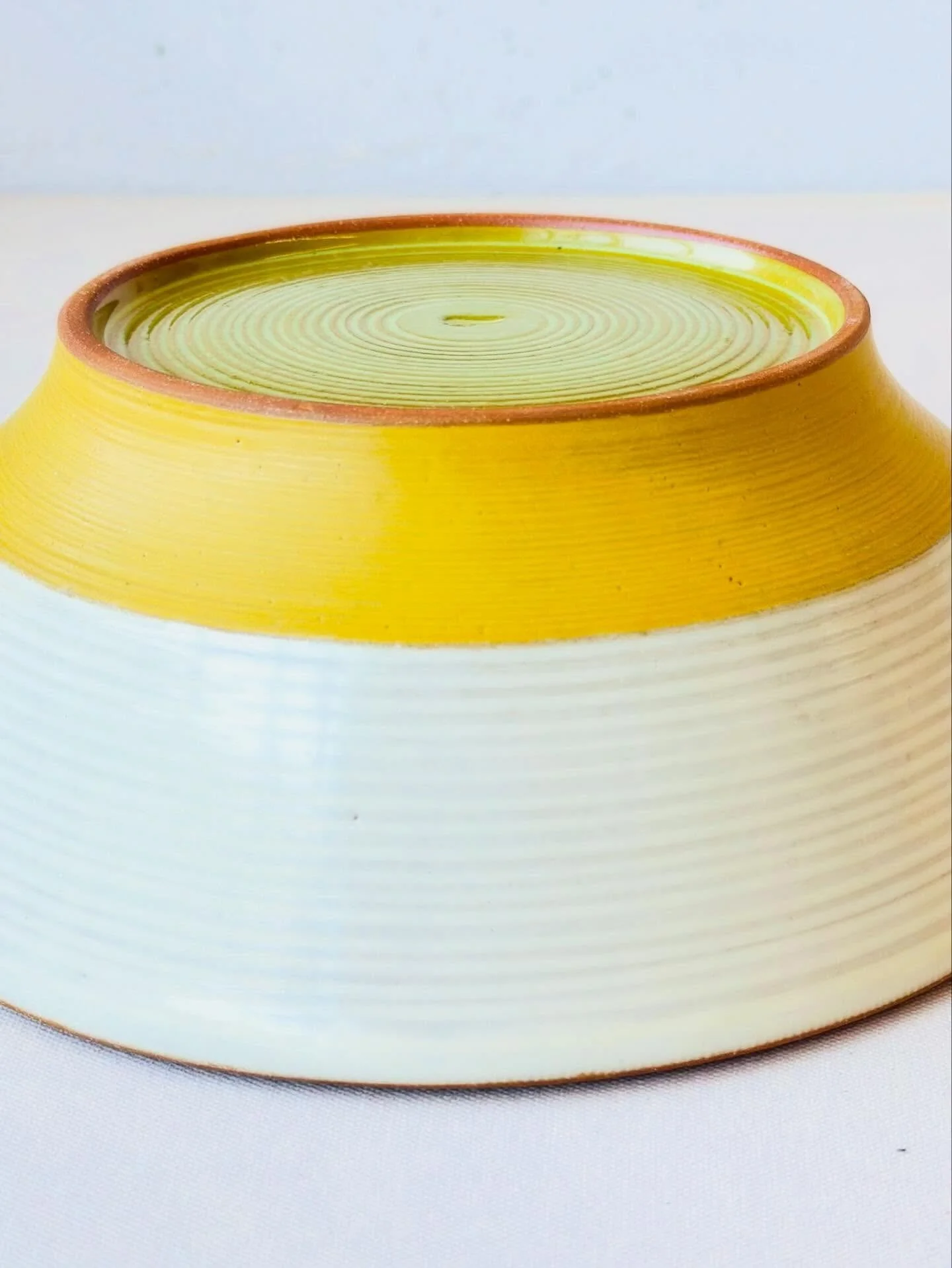 I&rsquo;m testing an accent color to complement the yellow glaze.  I really like how this piece came out, the bottom of this bowl ended up being more interesting! 🤔 
#handmadebowls #handmadeceramics #SanFranciscoceramics