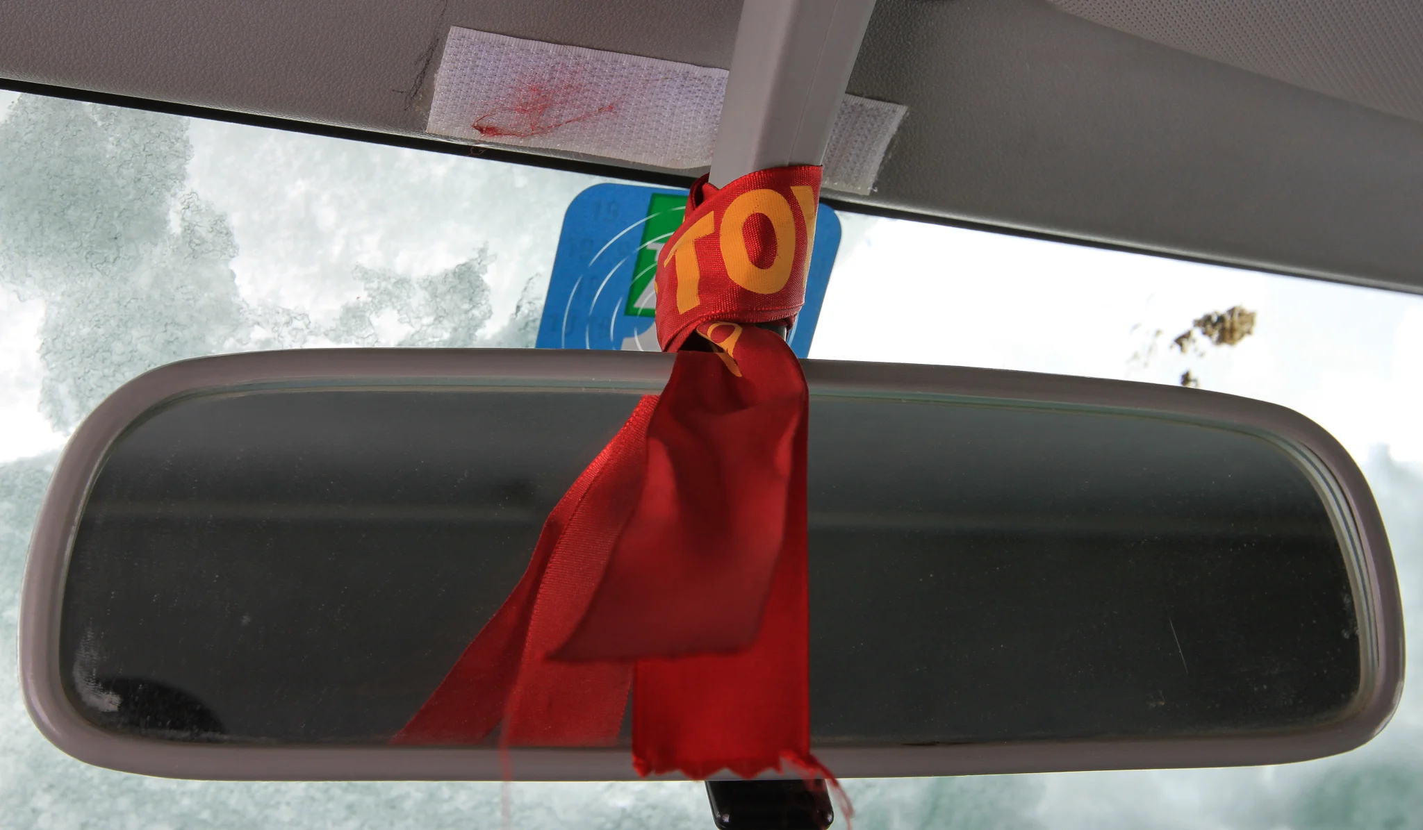 THE STRIP OF RIBBON BOUGHT FROM THE SHRINE OF DIFUNTA CORREA.