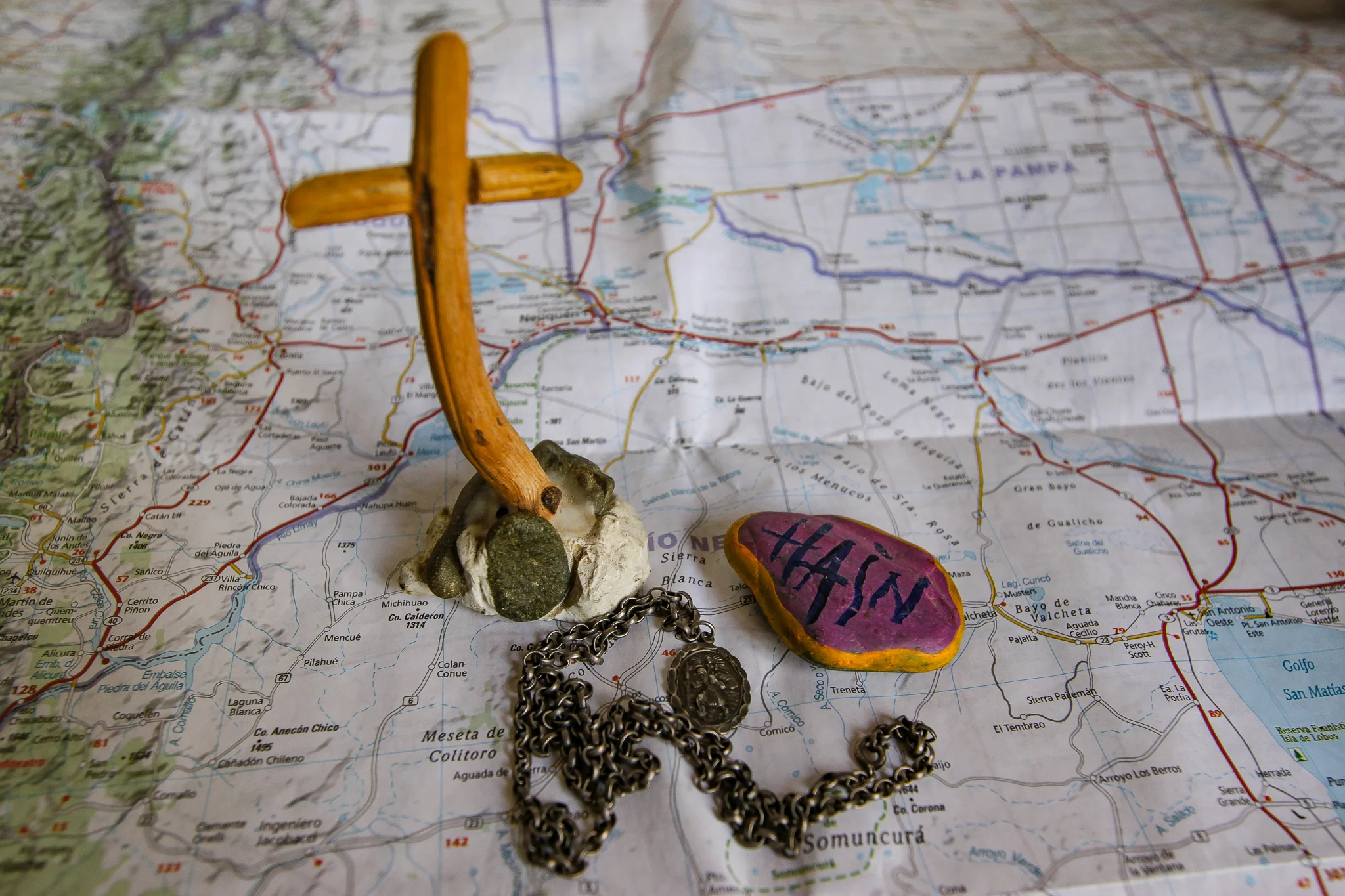 THE NOHELIA CROSS, THE ST CHRISTOPHER PENDANT AND THE HAIN PEBBLE.