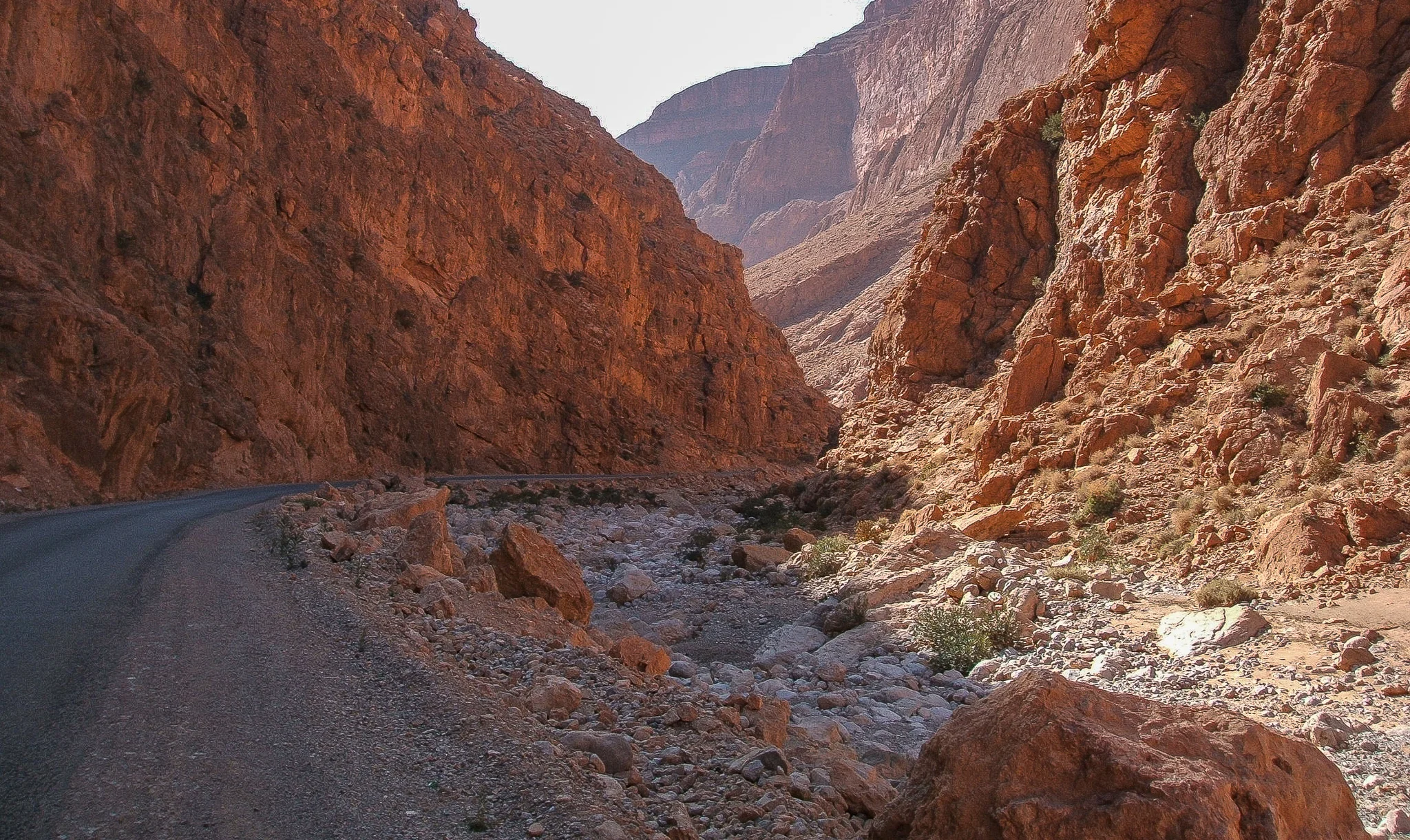 THE ROAD CUTS THROUGH THE CANYONS IN THE HIGH ATLAS MOUNTAINS.