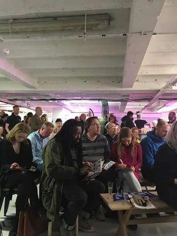 Happy bidding! Eager bidders during the auction.