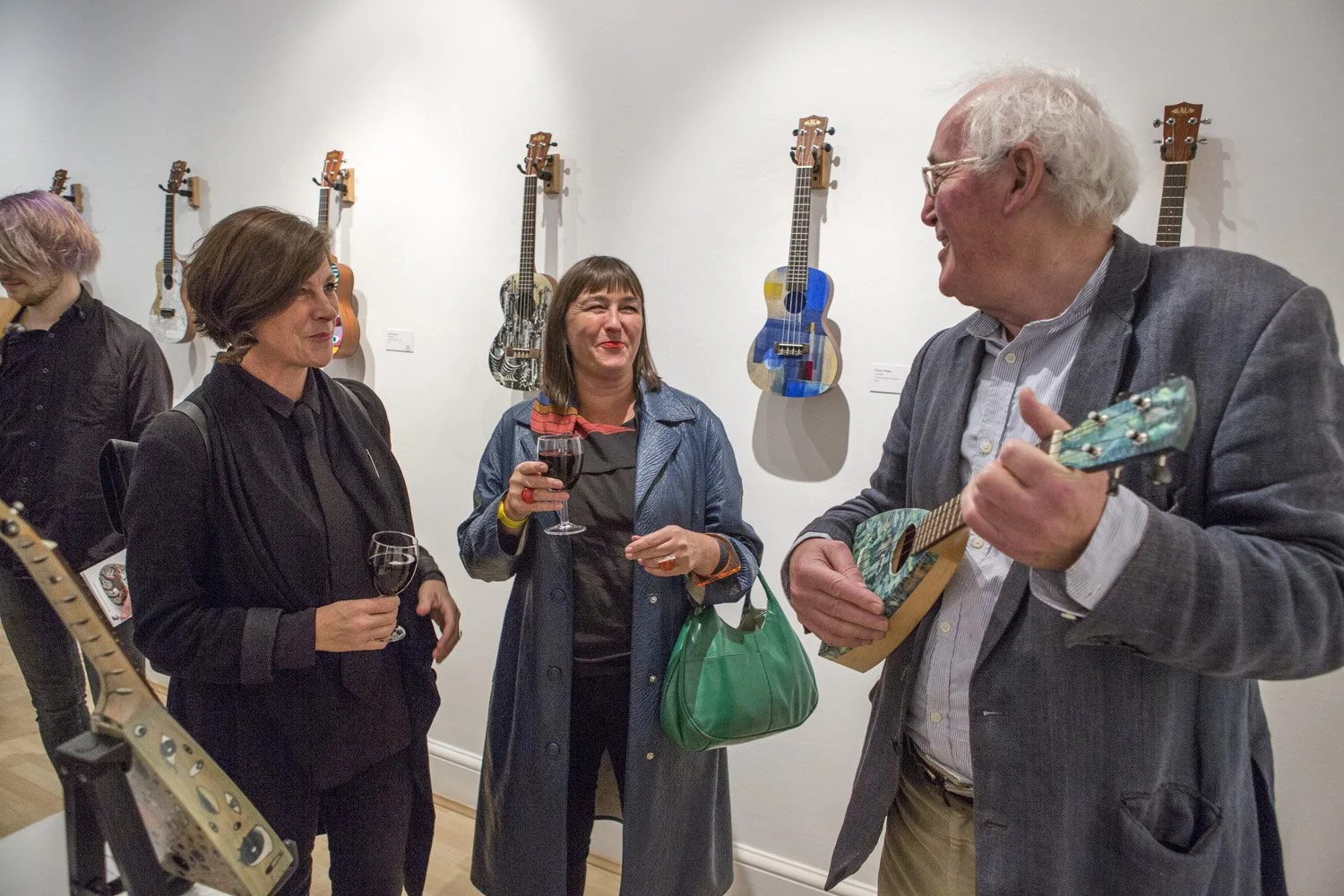 Mick Rooney RA plays his Uke to members of The Ukulele Orchestra of Great Britain