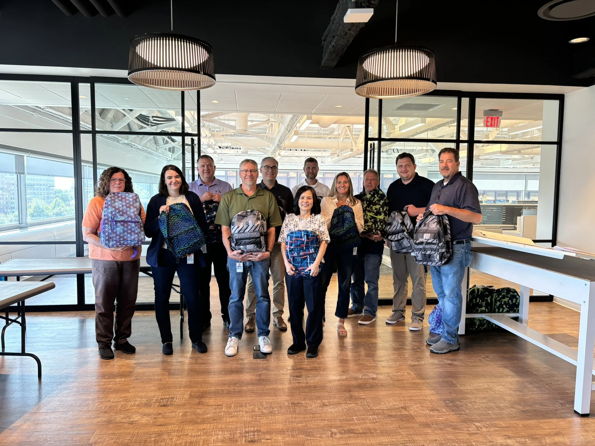 Wick Fisher White Team Participates in Salvation Army Backpack Drive