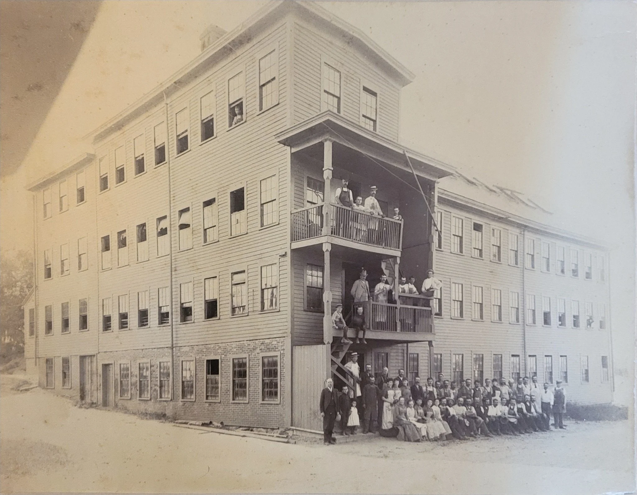 What was likely just another regular workday for the employees of the Felch Shoe Factory on the corner of Bacon Street and North Main Street is a preserved piece of history in our archival photo collection. Other images in our collection suggest that
