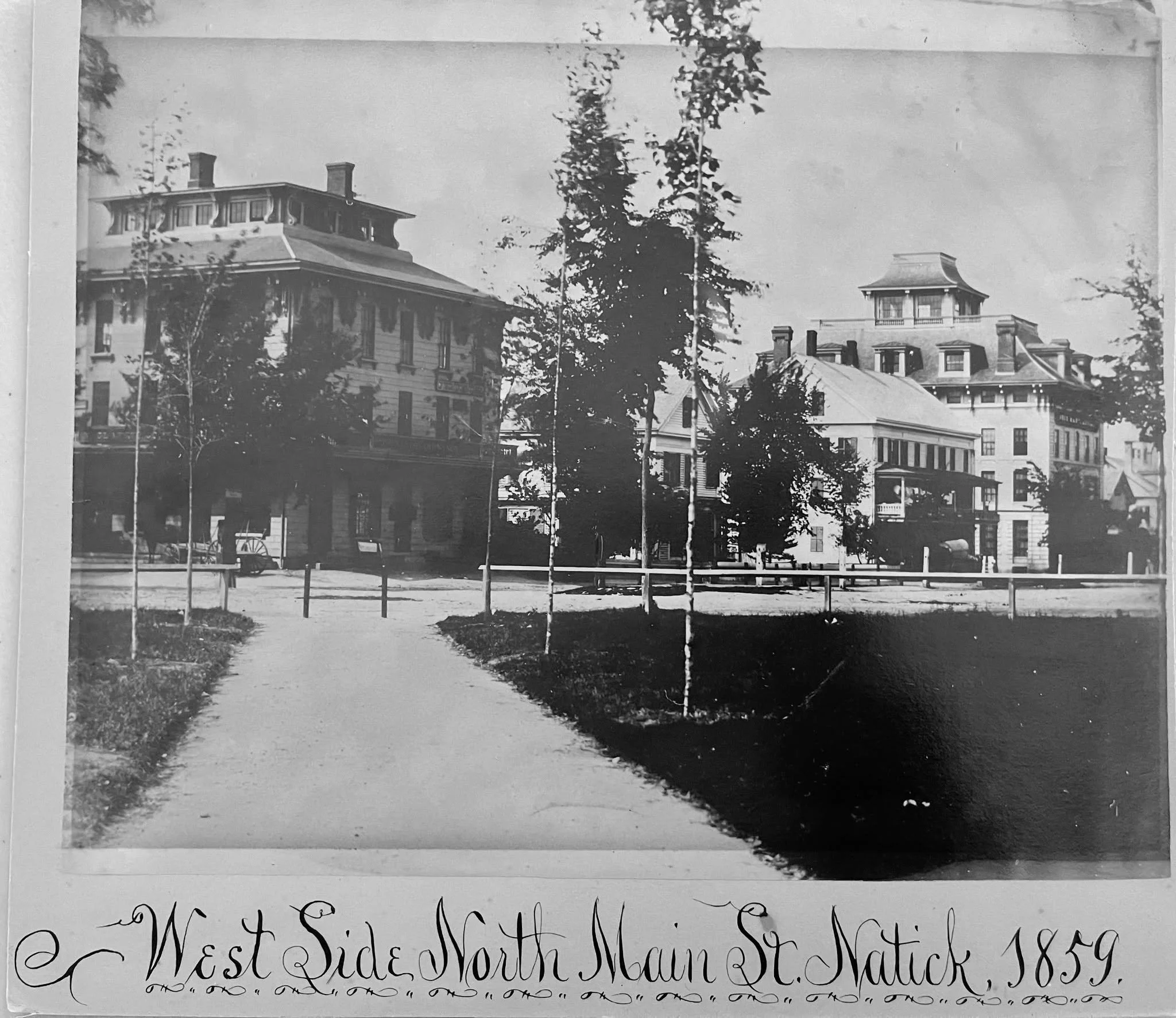 🌳Do you recognize this part of downtown Natick? This is a 1859 view of the west side of Main Street, before the 1874 fire. Notice Clark &amp; Winch's store (first building on left), Nathaniel Clark's residence (second building), and J.B. Walcott Sho