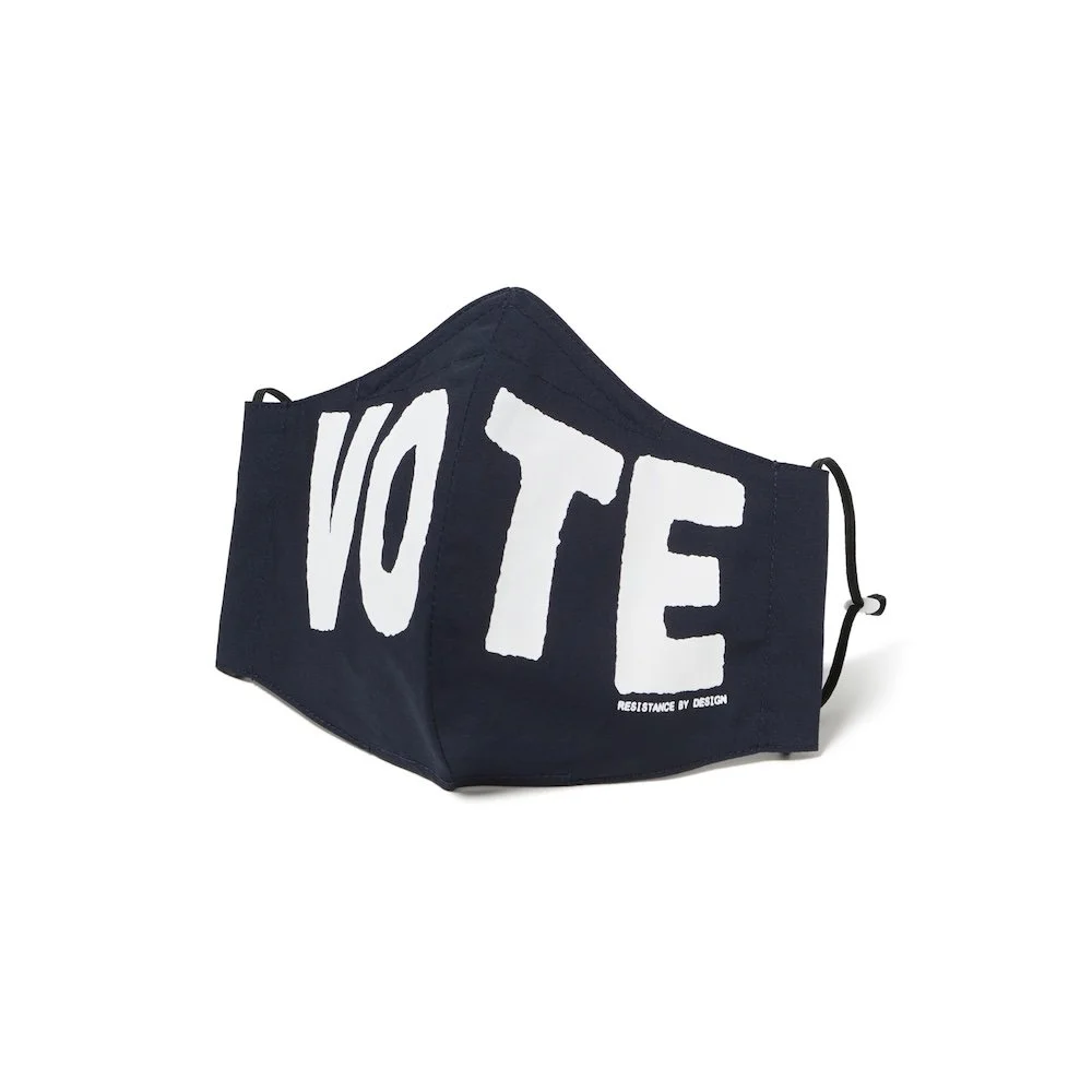 Black face mask with large white letters spelling 'VOTE' on the front.