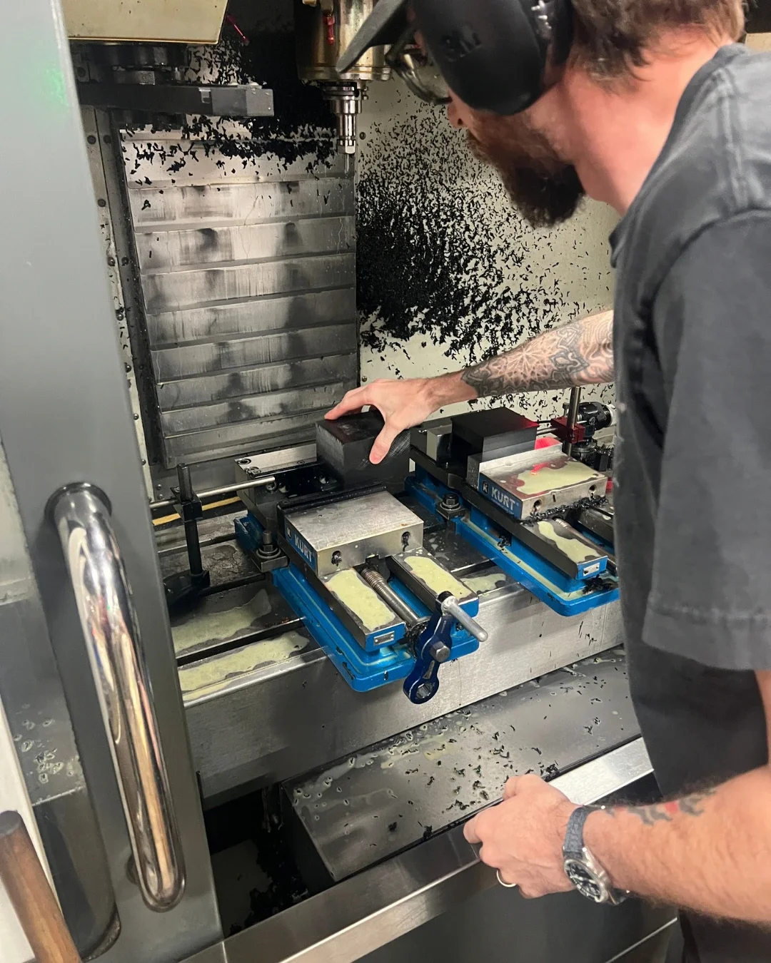 Tektonics Design Group's machine shop manager making custom components on a Haas CNC machine, steps away from the industrial design office.