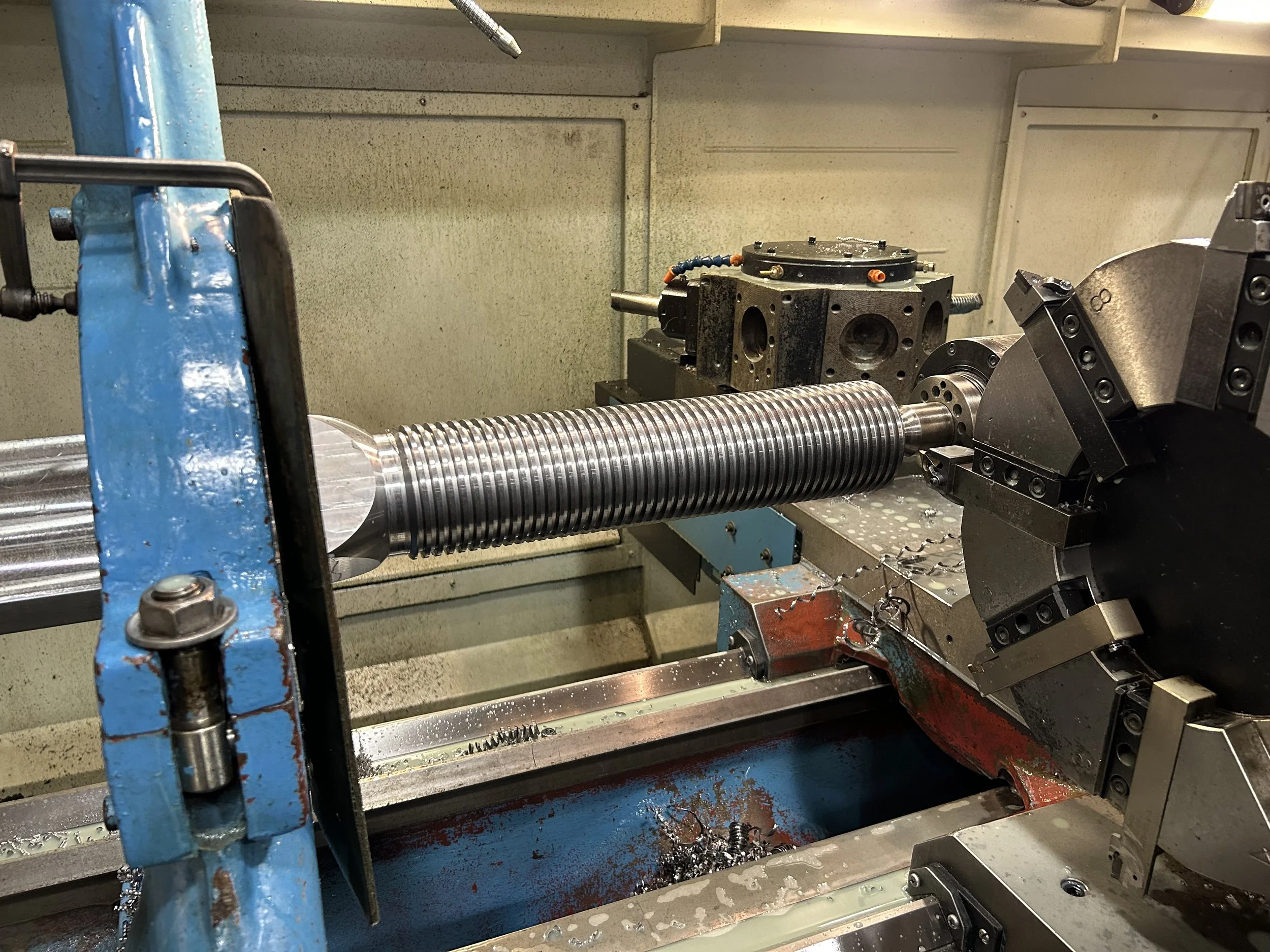 Thread cutting in a CNC lathe.