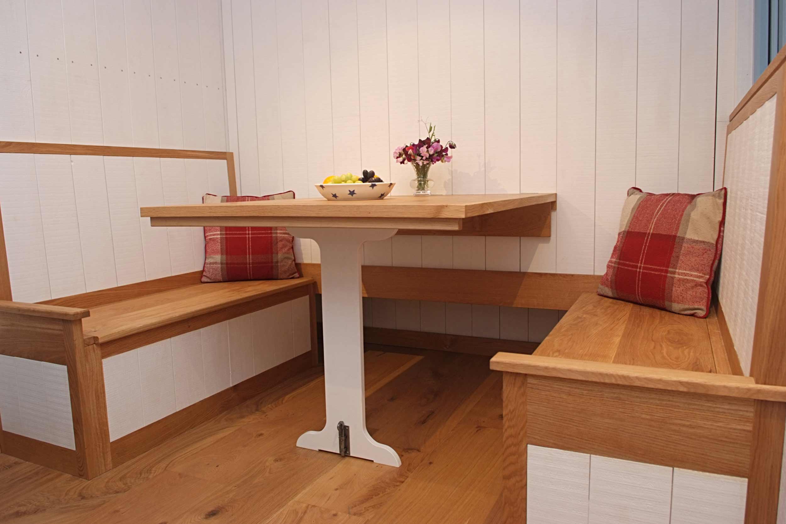 Shepherds Hut Dining Area with Fitted Seating and Drop Down Table