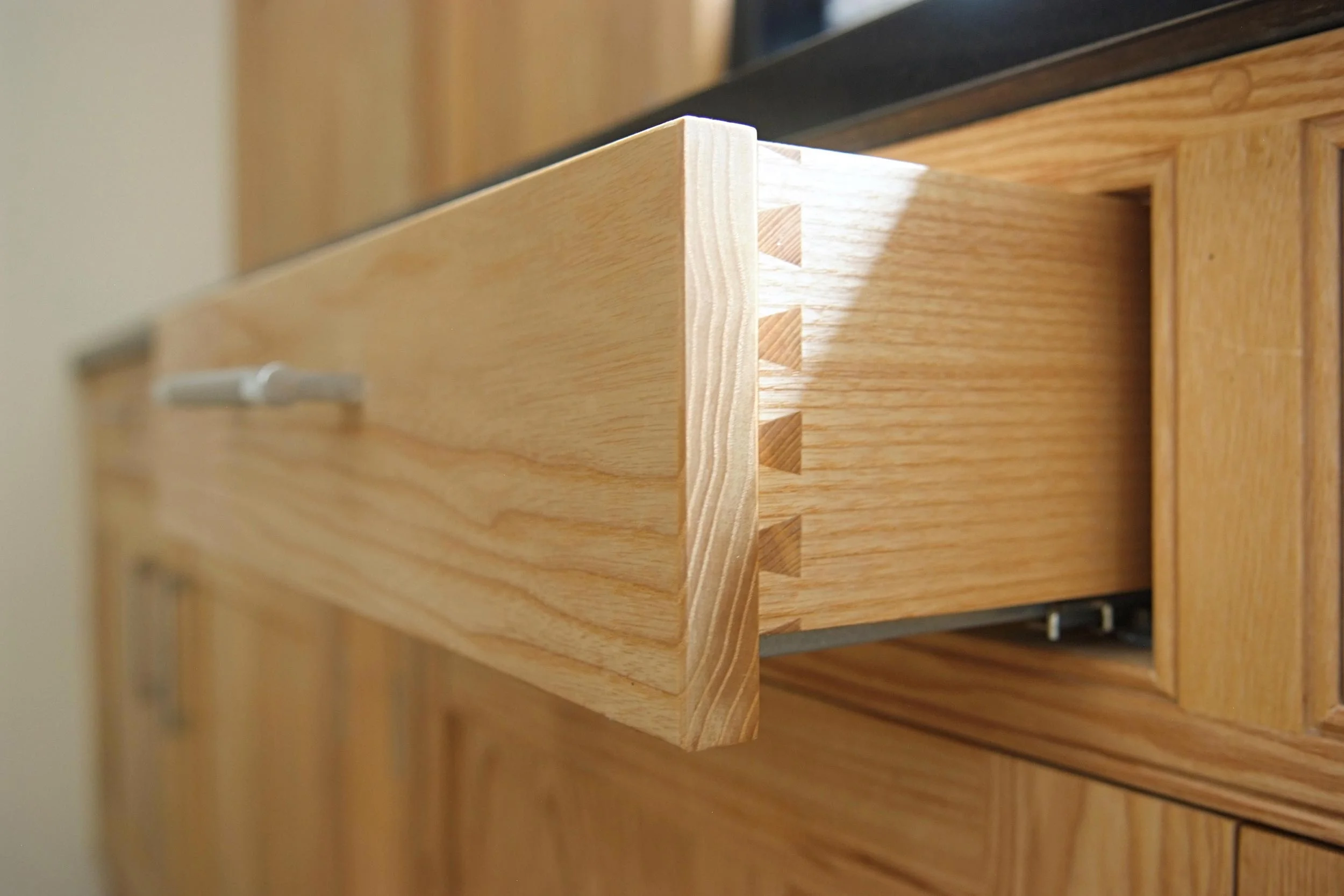 The finished kitchen drawers showing dovetail joints