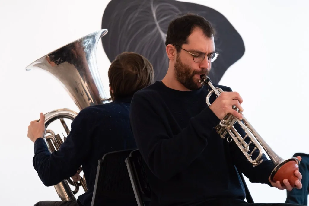 For "The Hanging Quilts of Measure," Max Murray (tuba) and Adi Snir (sax/trumpophone) turned the artist's stitches into improvisations. Kevin Grady/Radcliffe Institute
