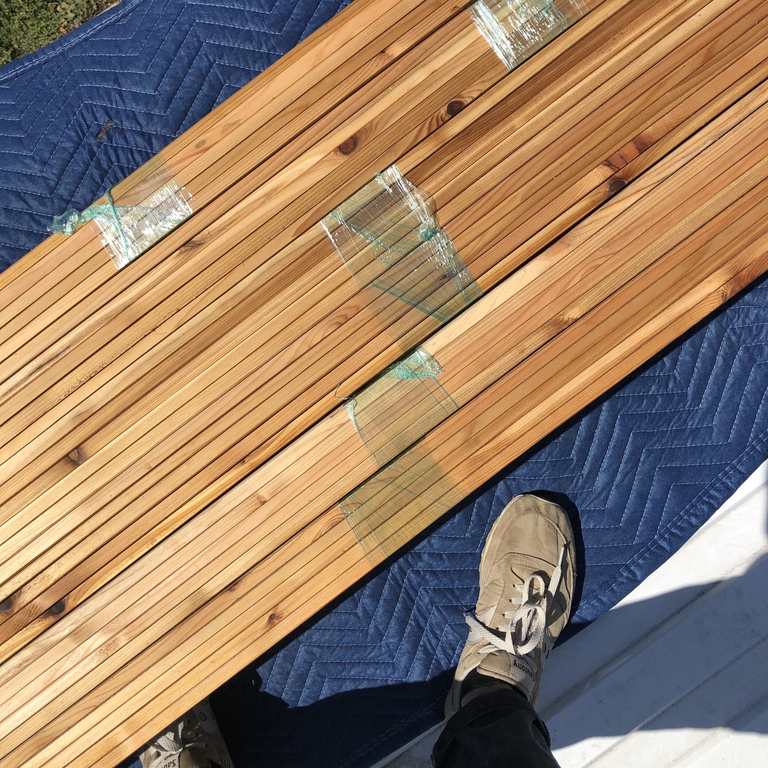  Cedar slats were oiled and then bundled to prevent warpage.&nbsp; 