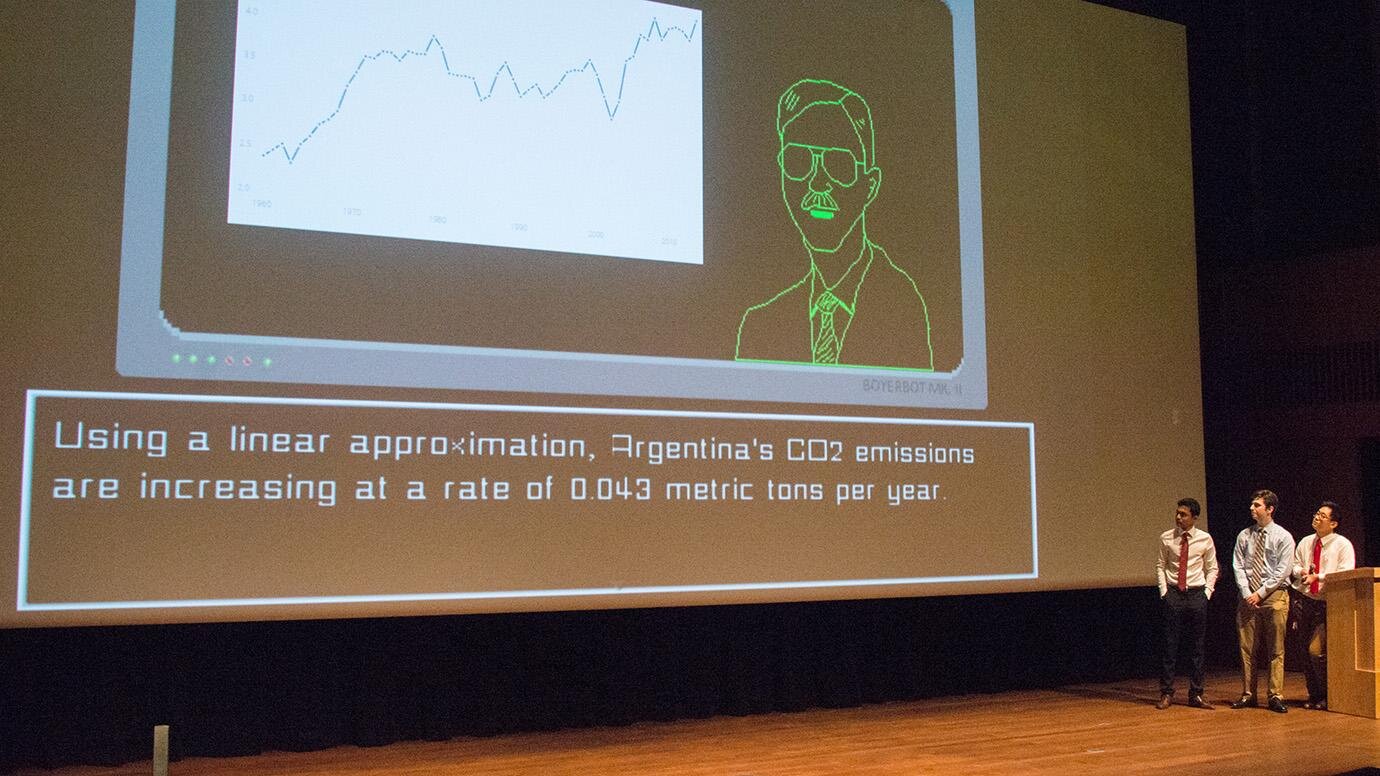  A team presentation at the Futures Design Challenge. Tyler Gao, Rohan Kumar and Luke Knuston of Team BoyerBot coded a conversational AI to incentivize people from different philosophical viewpoints to take action against climate change. Photo by Joe