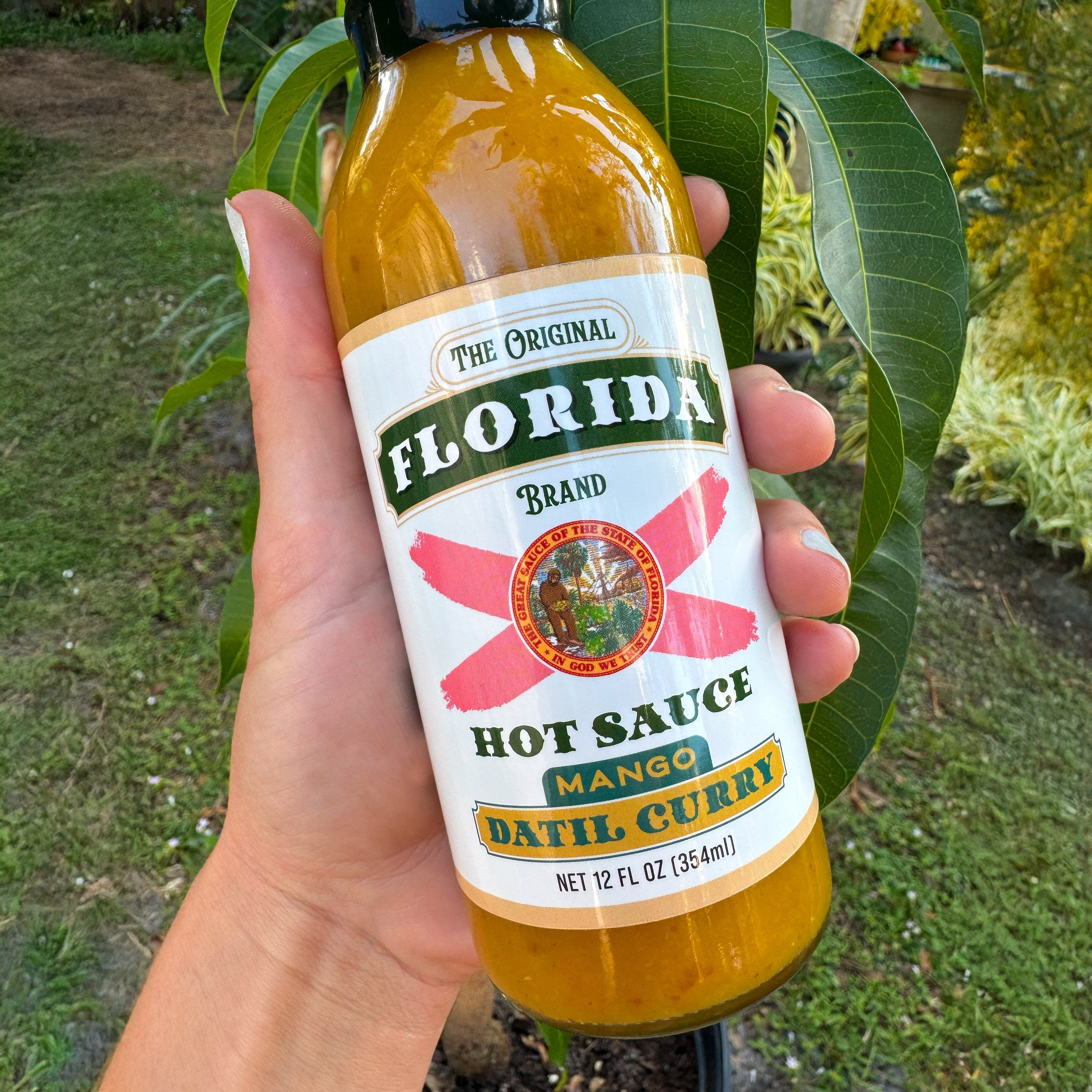 Florida-Hot-Sauce-Mango-Datil-Curry-Product-Image-in-hand.jpg