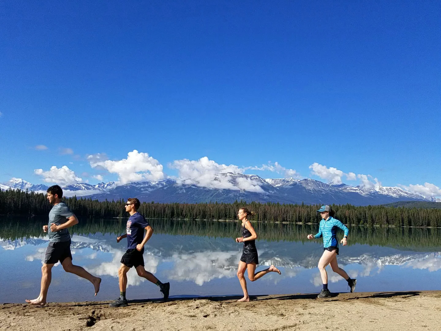 Trail running with Ryan, Paul, and Annie in June up in Jasper, Alberta. Missing these humans. (I made them take this photo a few times)