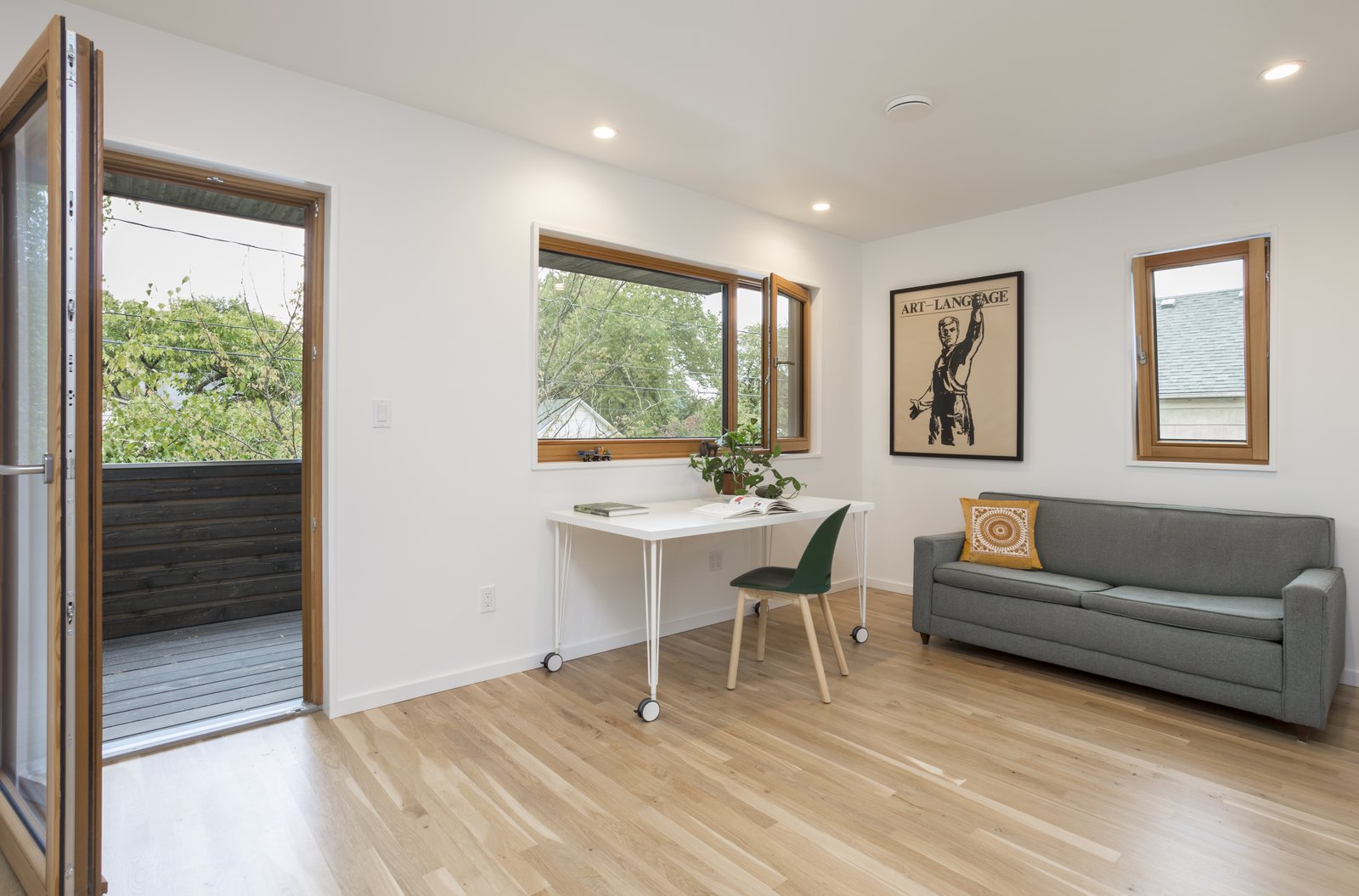 a-home-office-is-located-on-the-upper-floor-at-the-front-of-the-house-with-a-private-balcony-that-also-serves-as-the-covering-of-the-front-porch.jpg