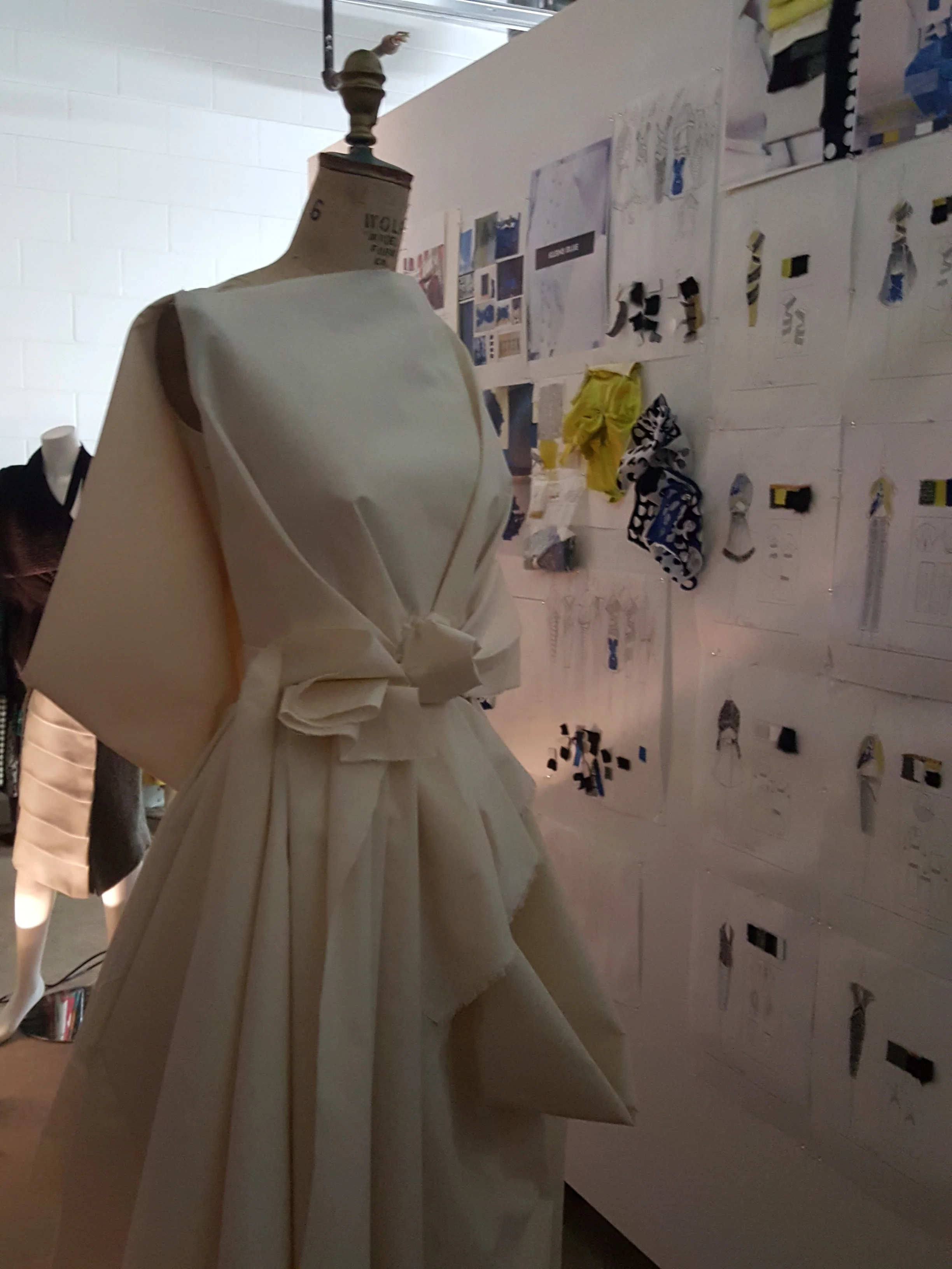 Anderson self draped muslin dress and wall with my sketches and inspiration.jpg
