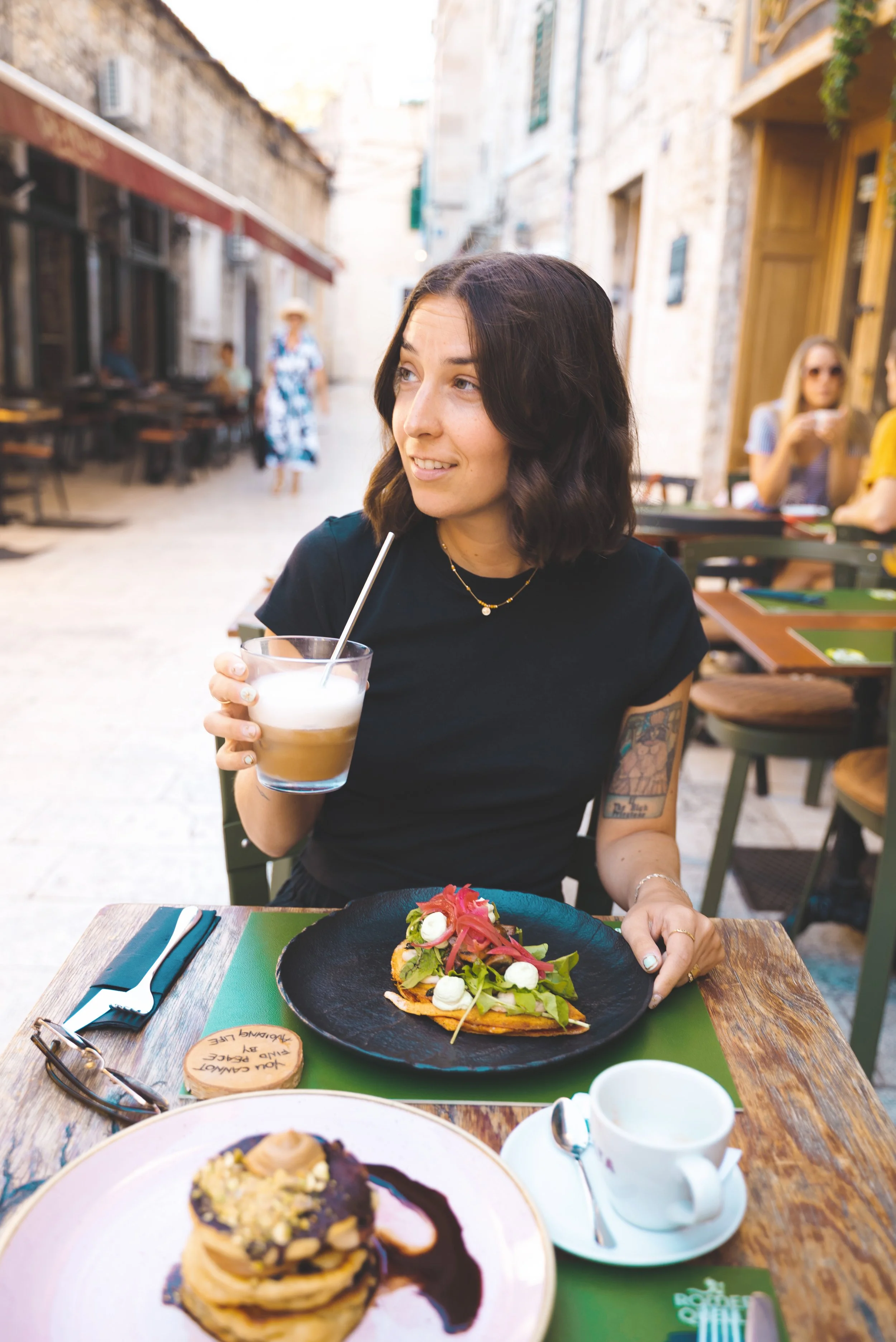 girl eating at pandoras greenbox split