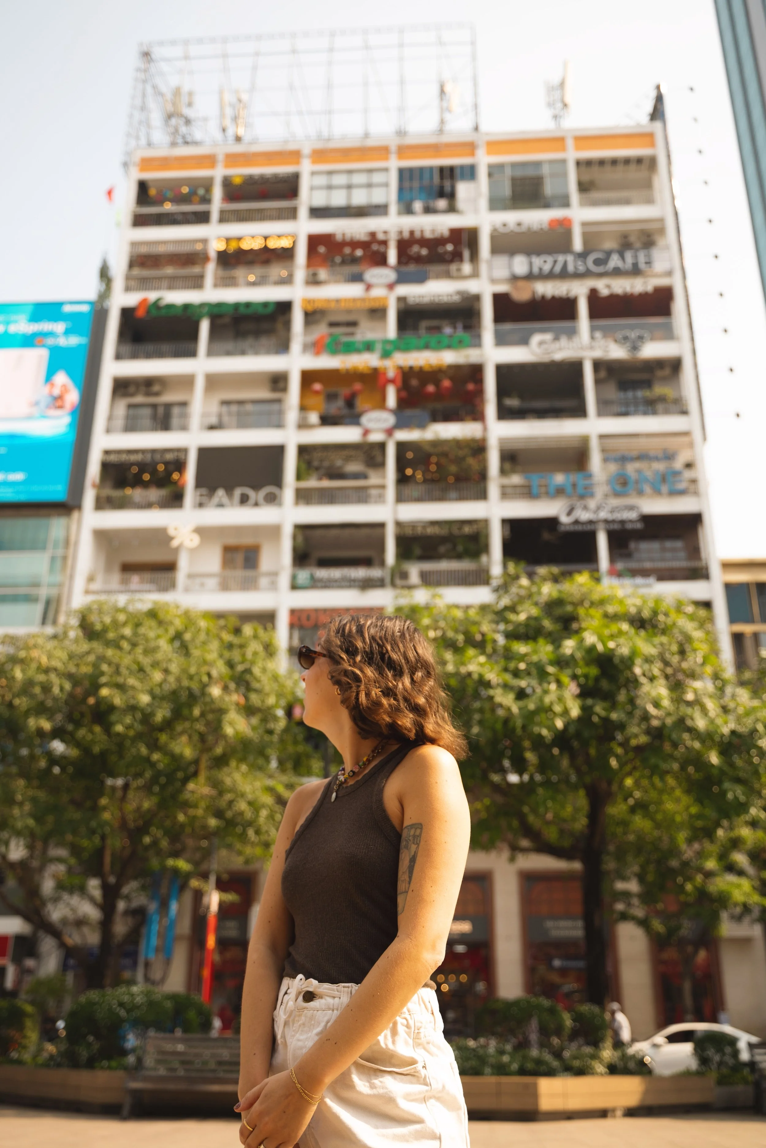 girl standing in front of the cafe apartments ho chi minh city