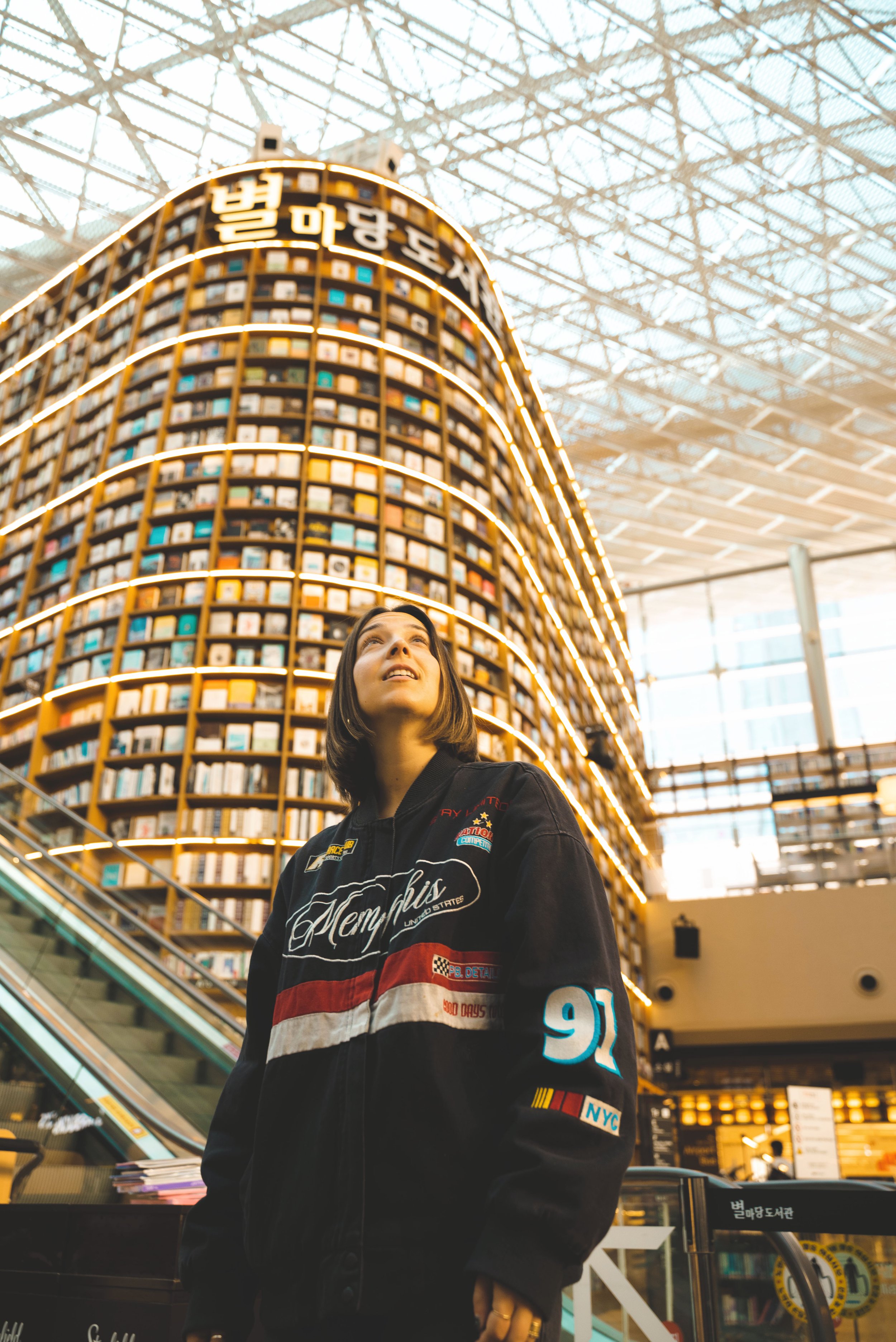 girl standing in starfield library at coex mall