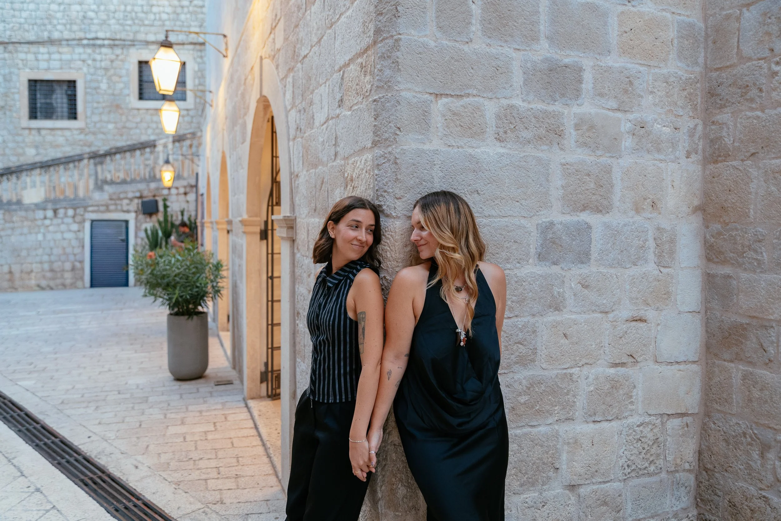 two girls holding hands in old town dubrovnik