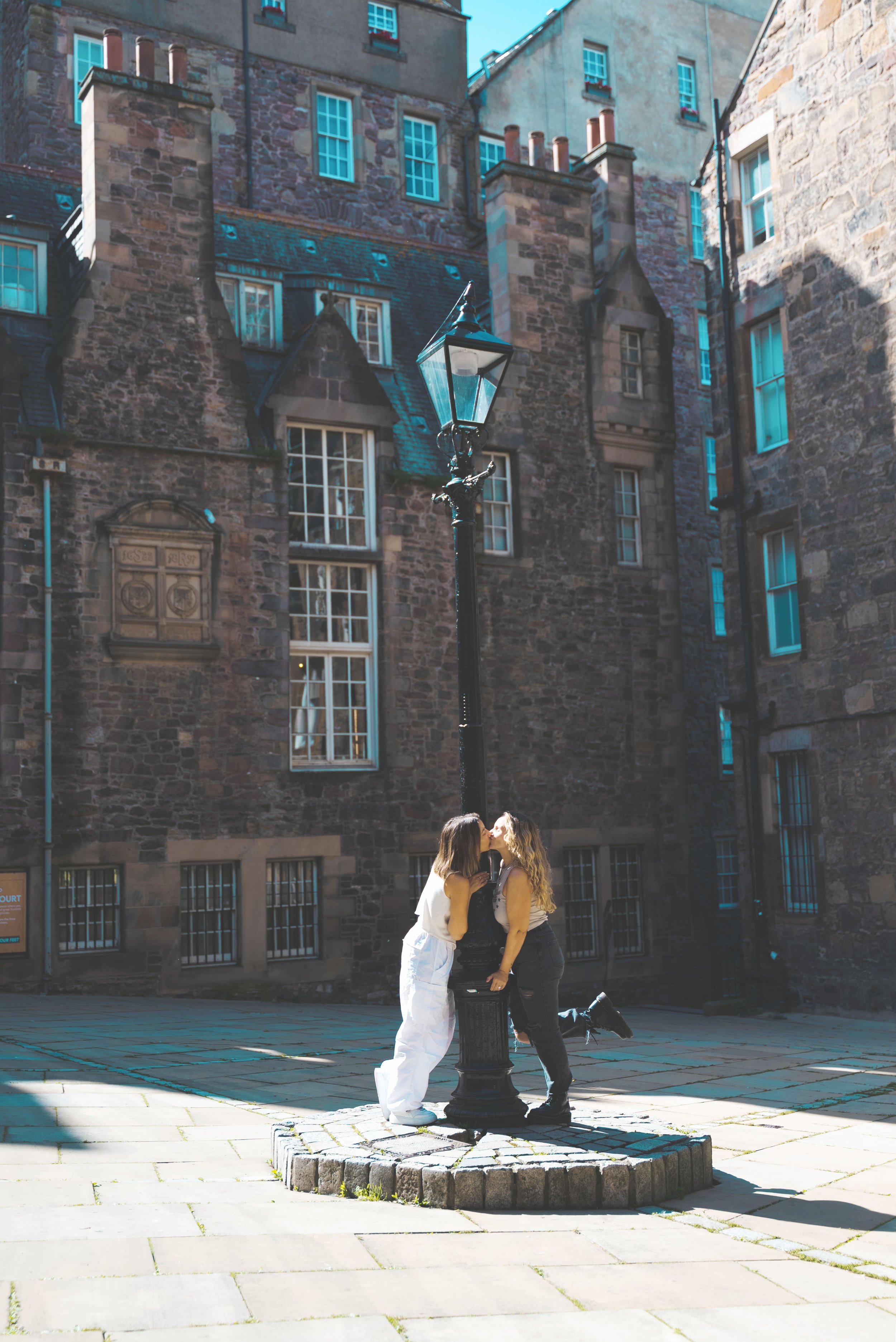 two girls kissing in makar's court edinburgh