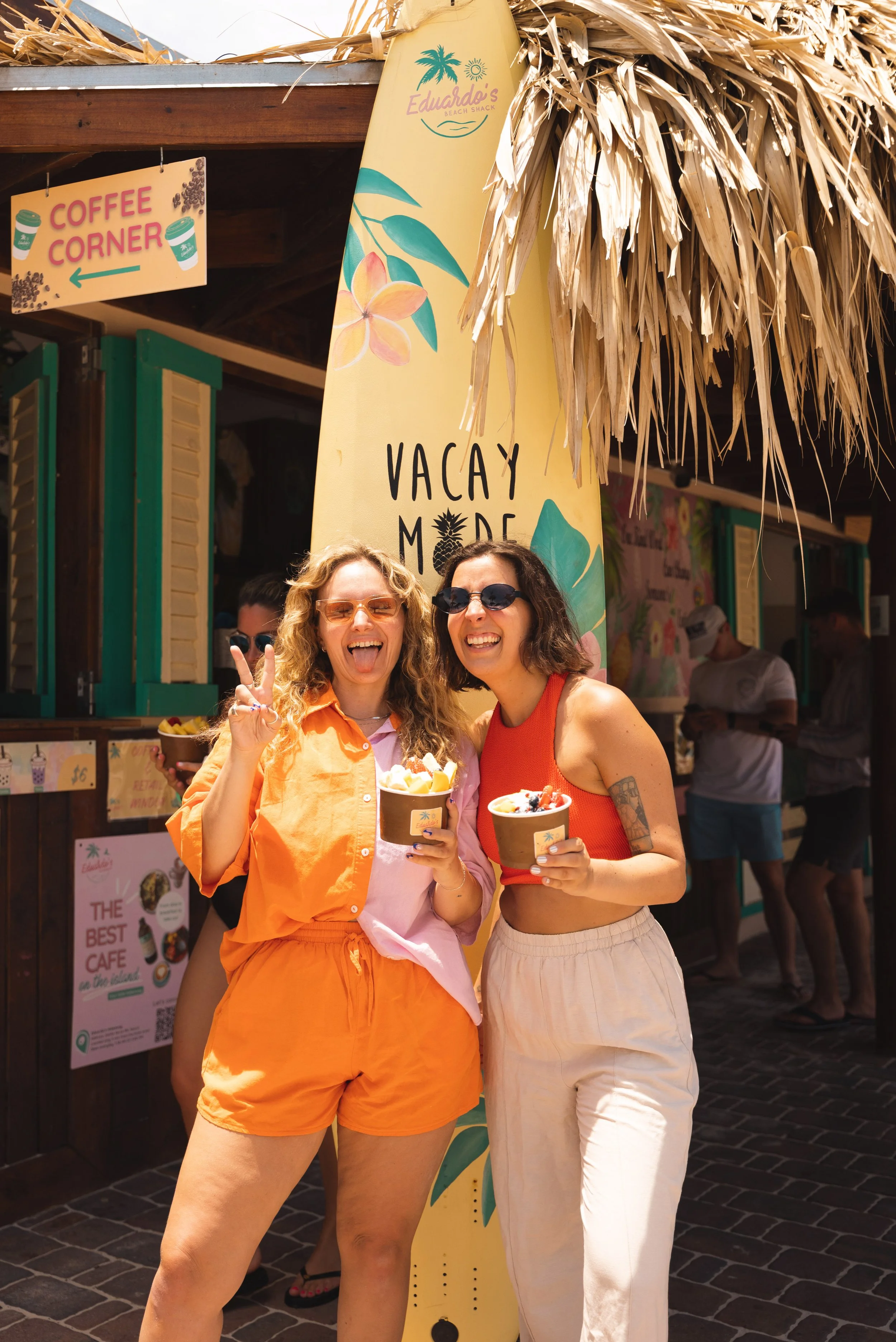 two girls outside eduardo's beach shack aruba