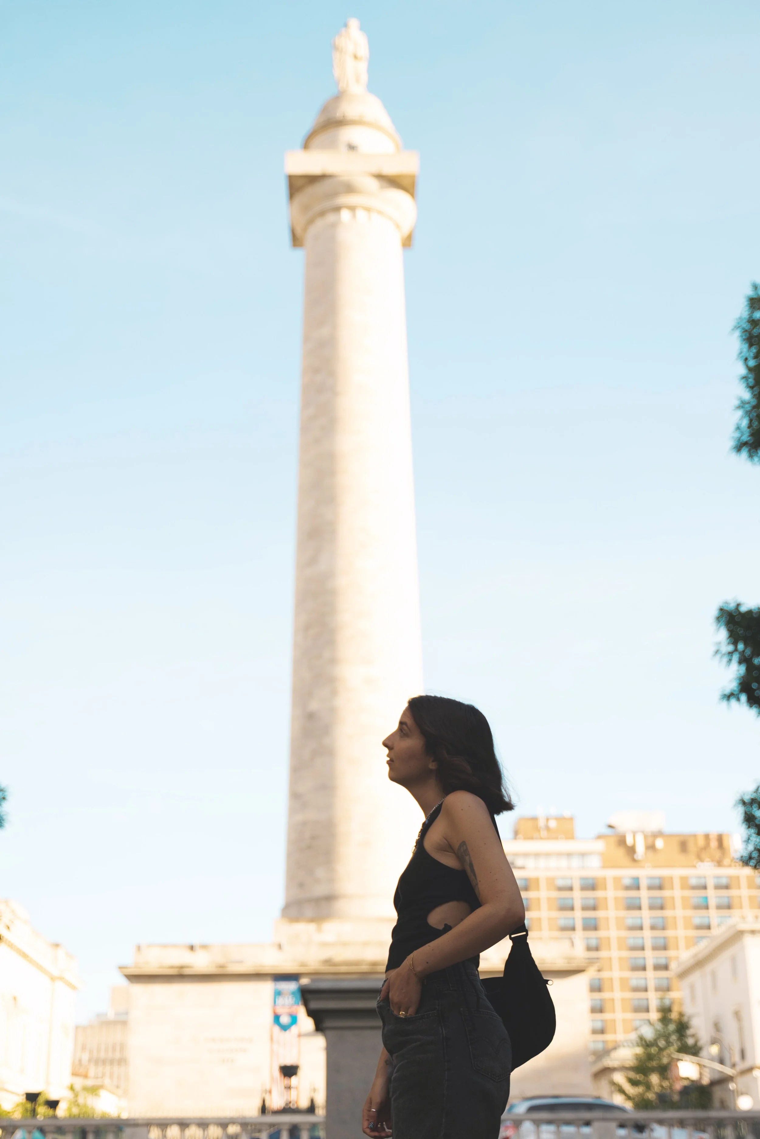 girl standing in front of washington monument baltimore