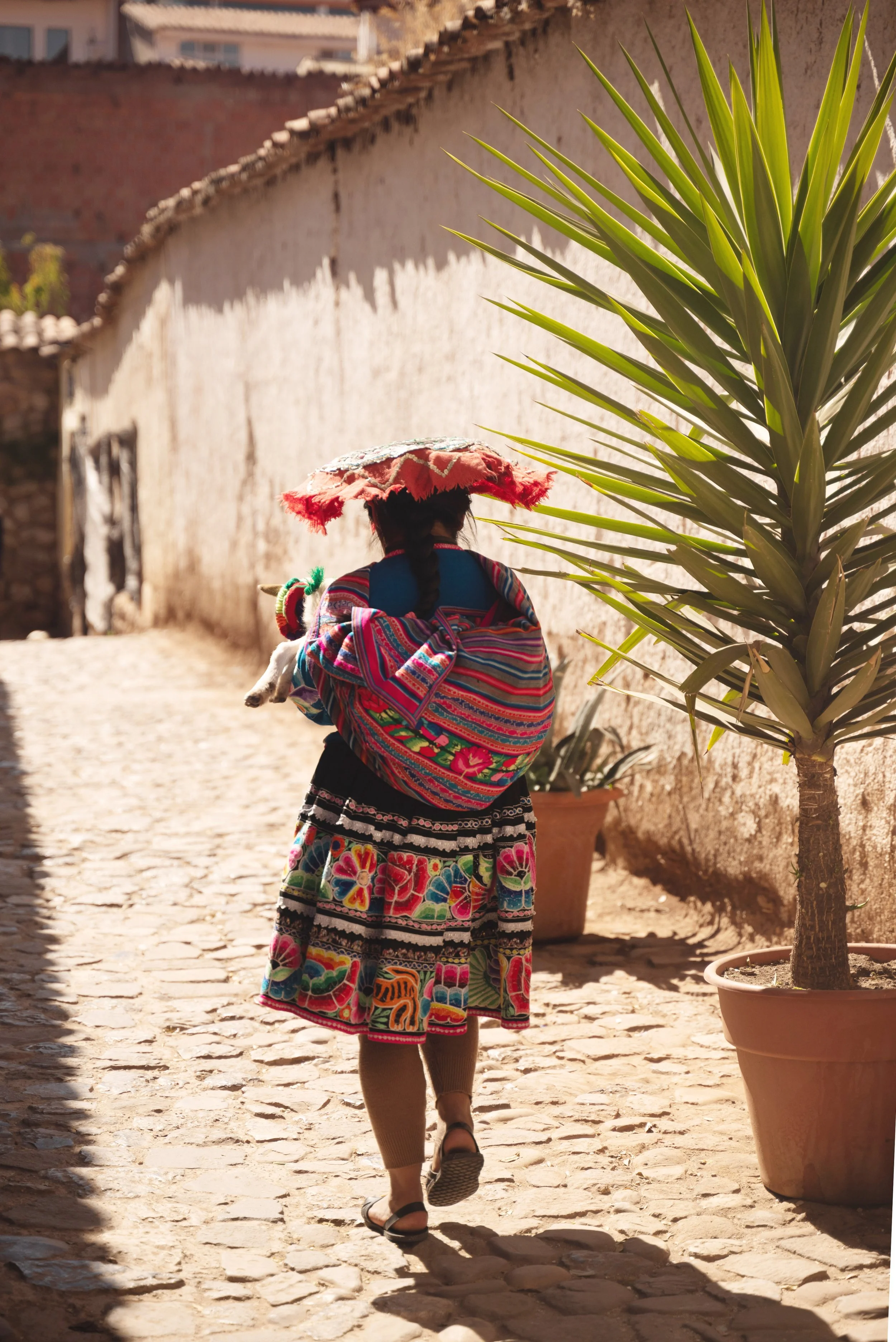lady walking in cusco peru