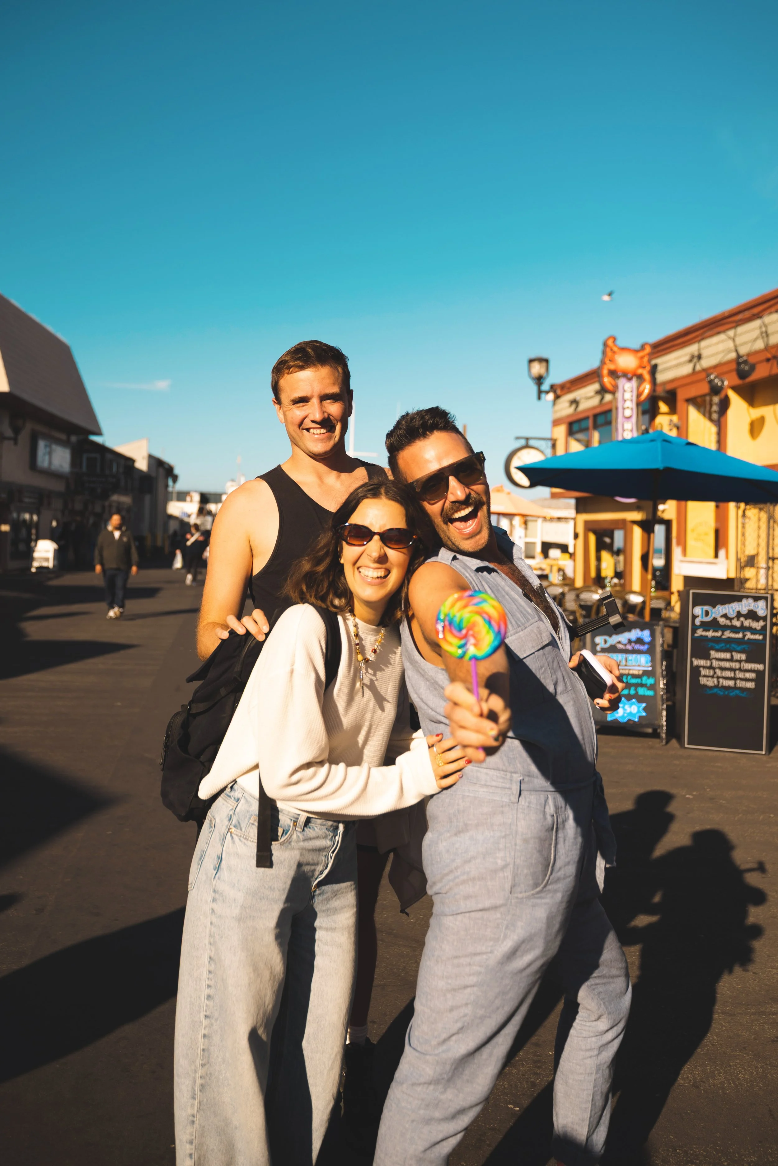 three friends on old fisherman's wharf monterey