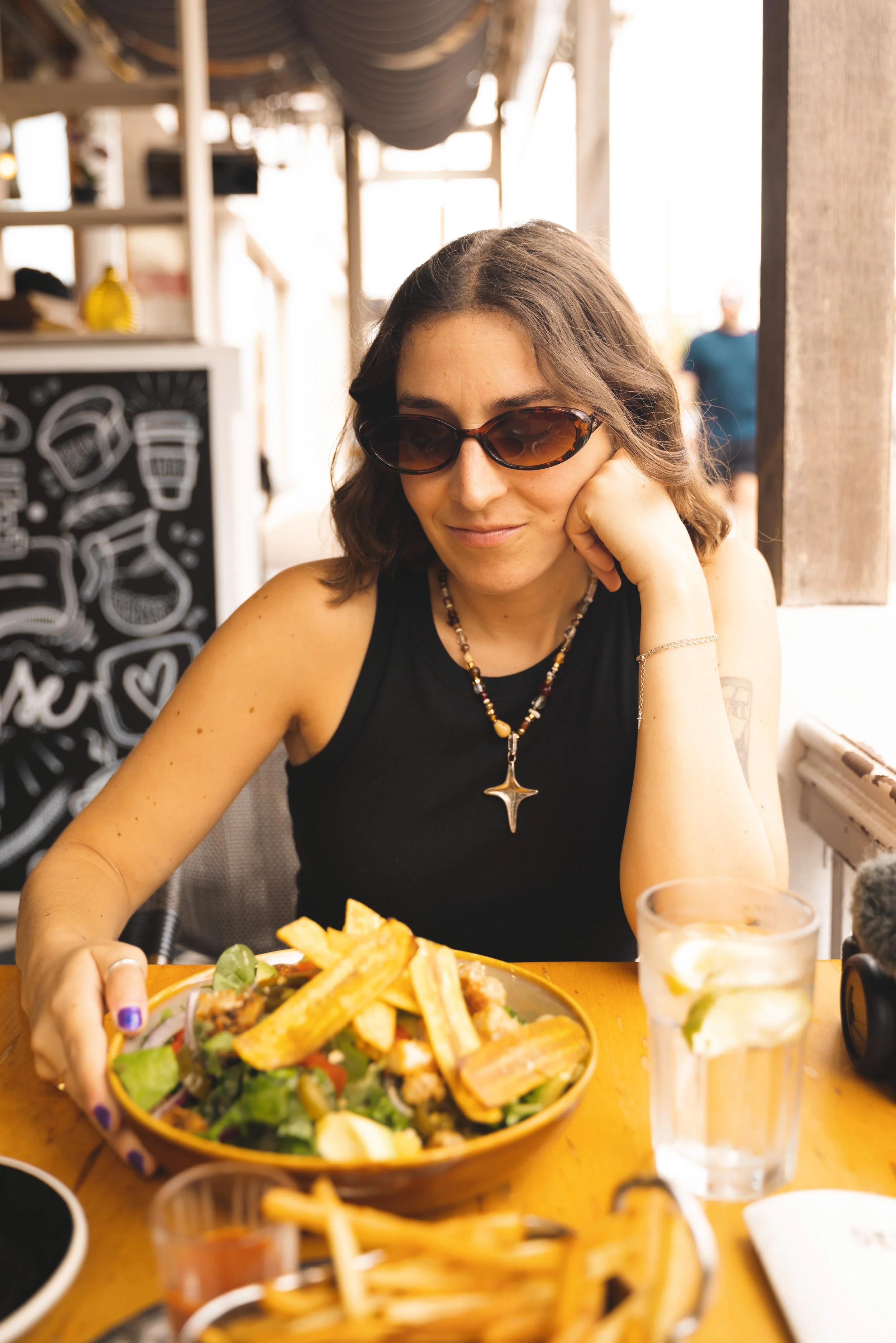 girl eating at Devil's Isle Cafe in Bermuda