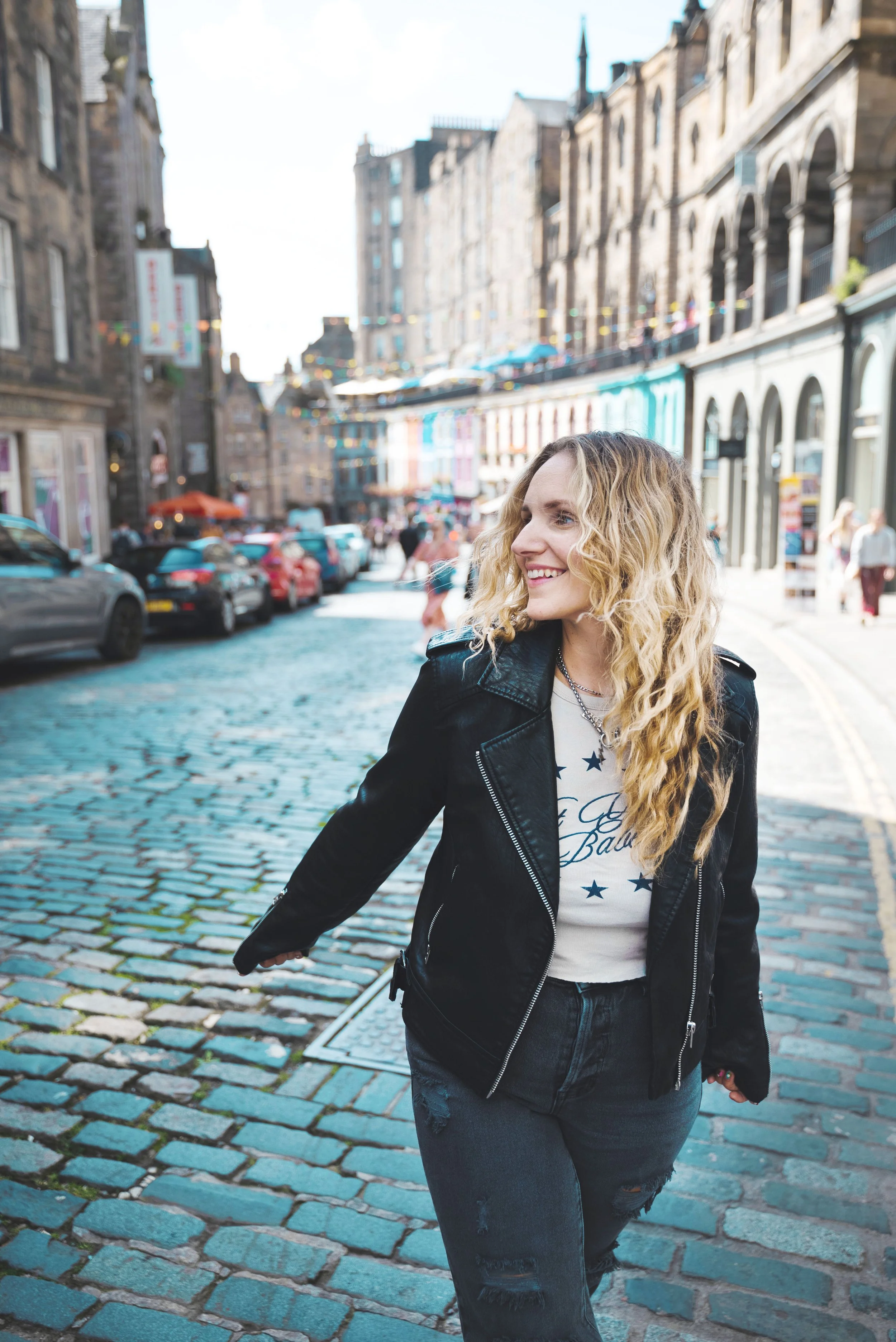 girl walking down victoria street edinburgh