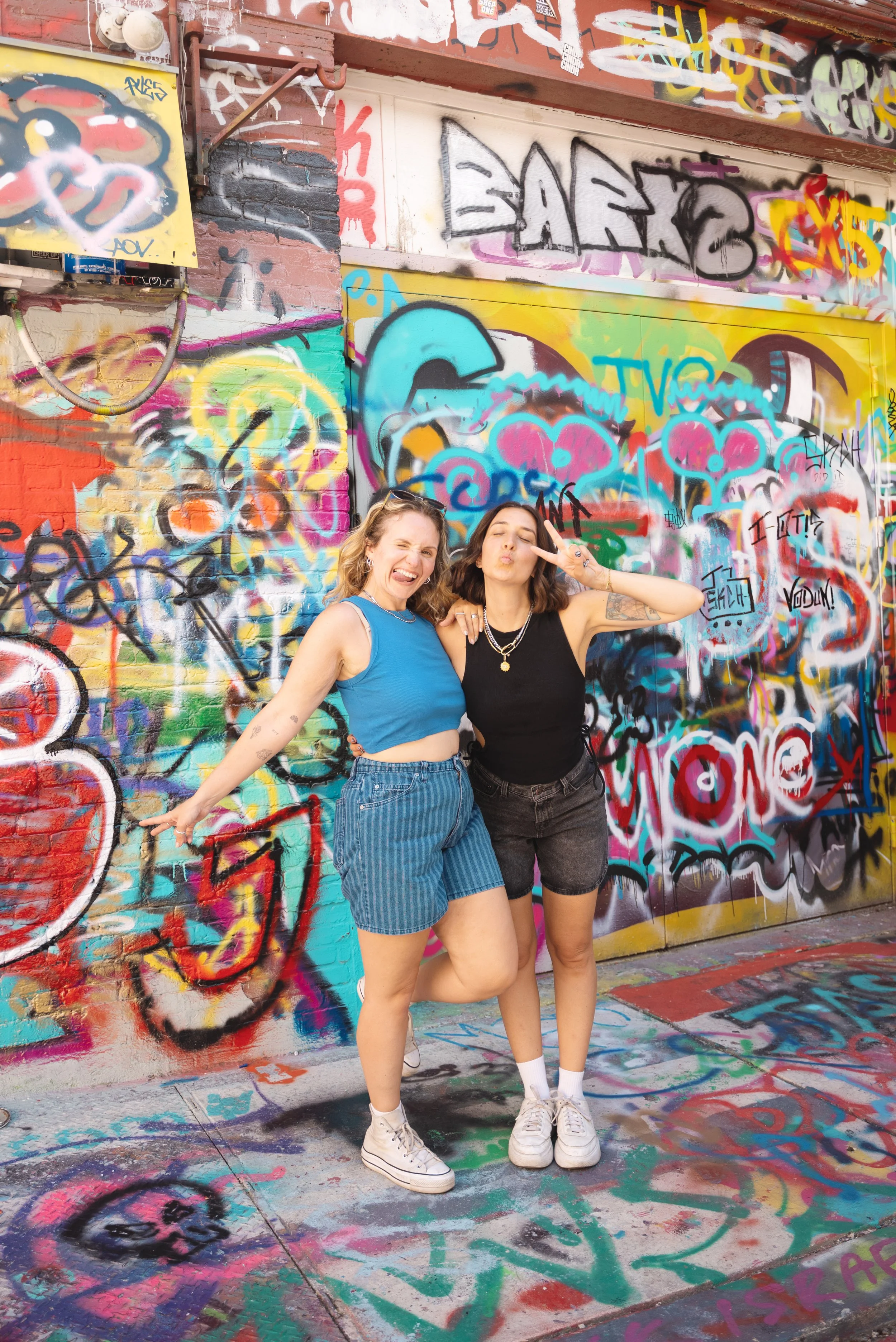 two girls in graffiti alley