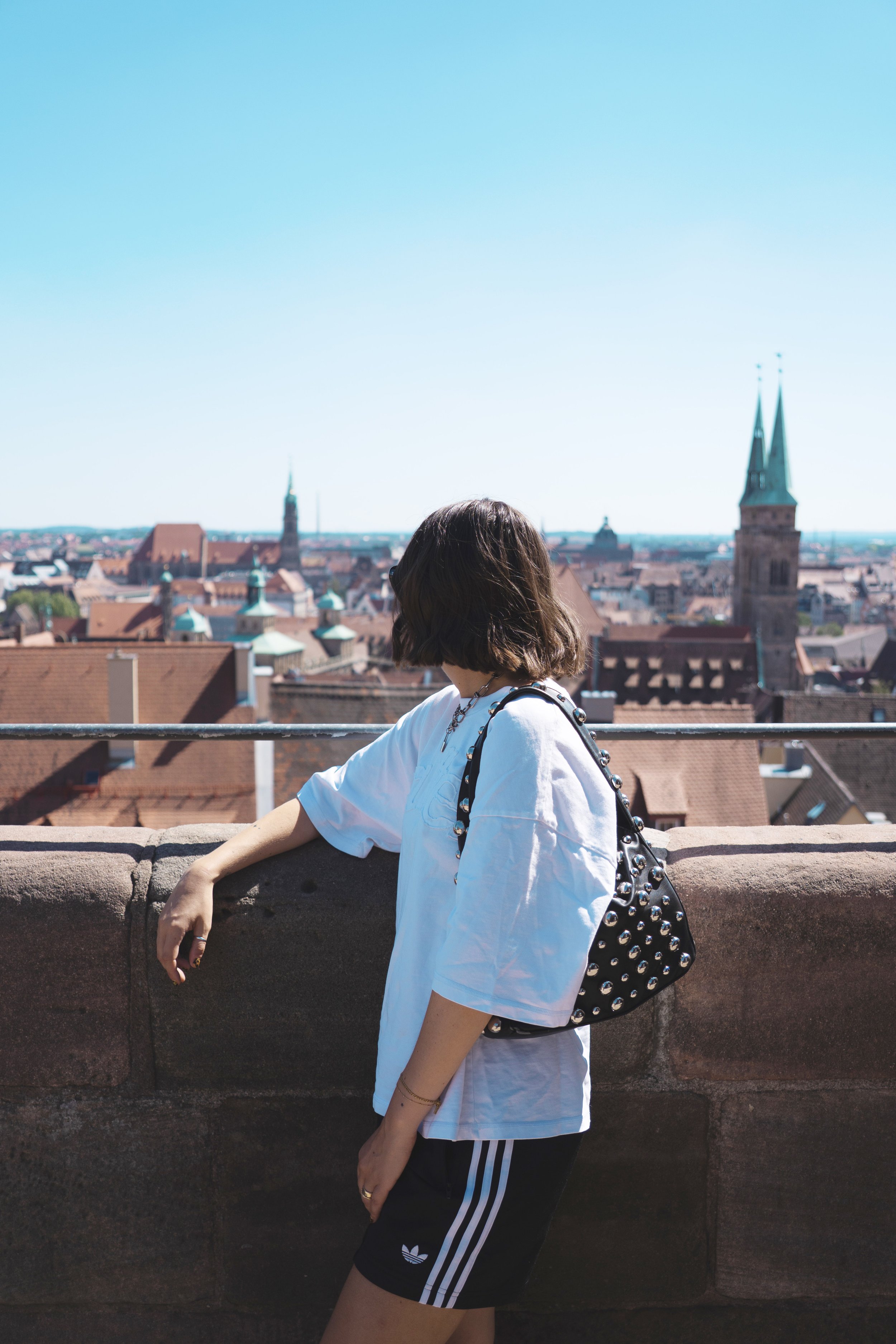 girl looking at view from the top of Imperial Castle of Nuremberg