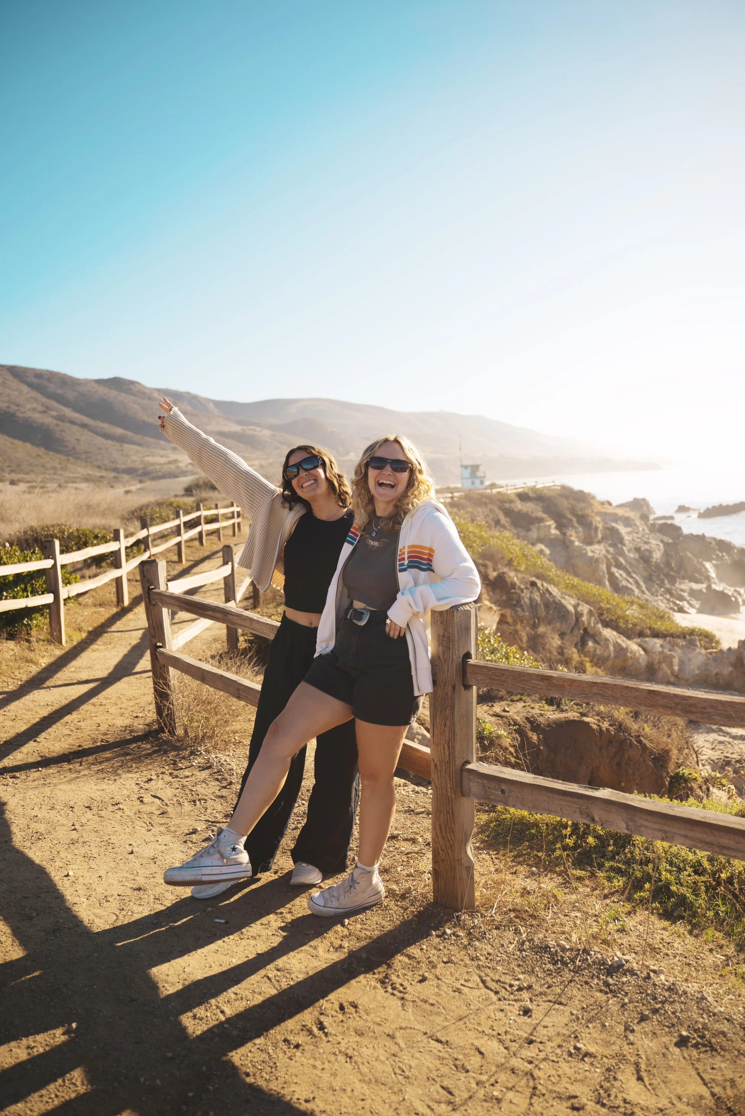 two girls on the beach in malibu on a california road trip