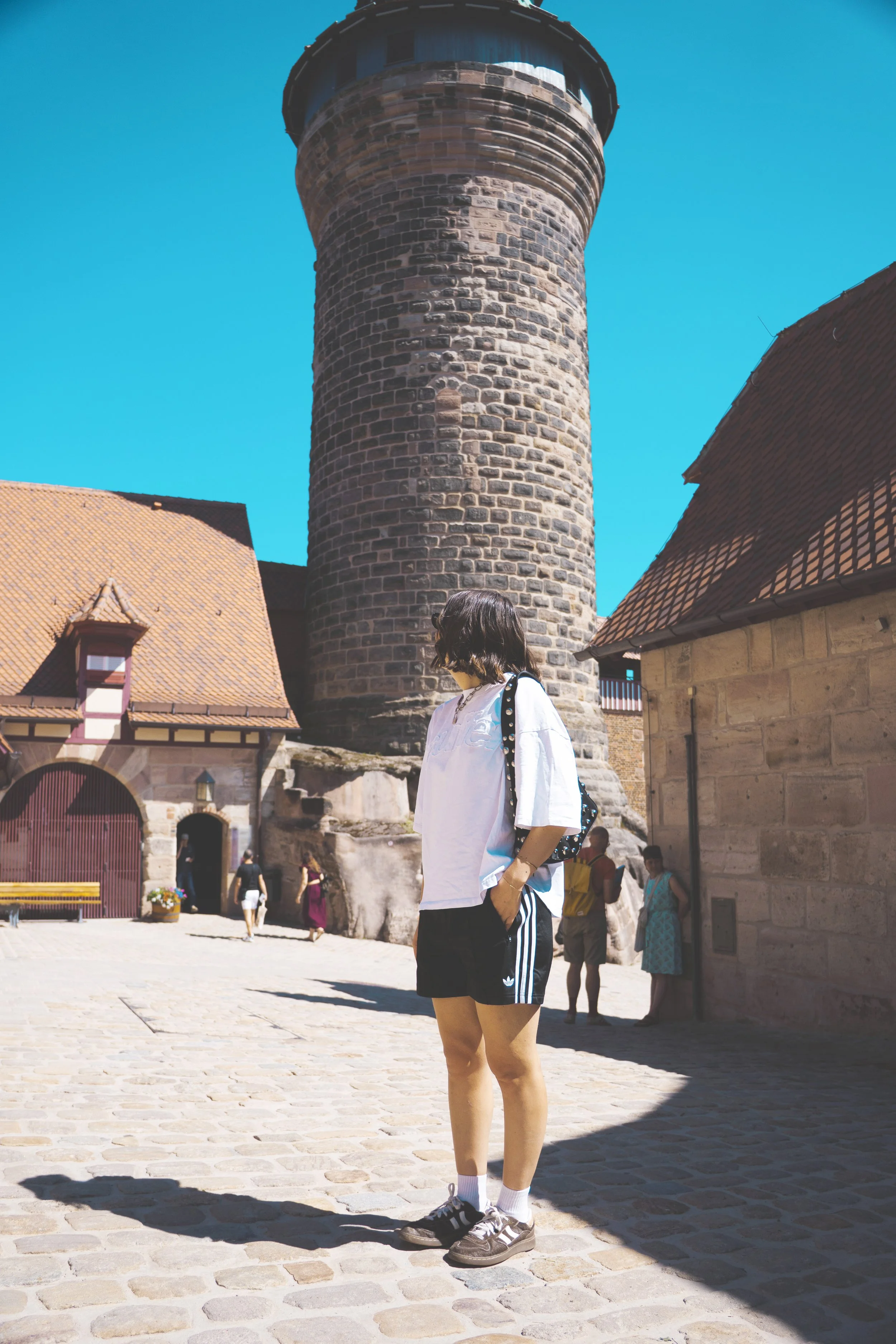 girl standing in front of imperial castle of nuremberg